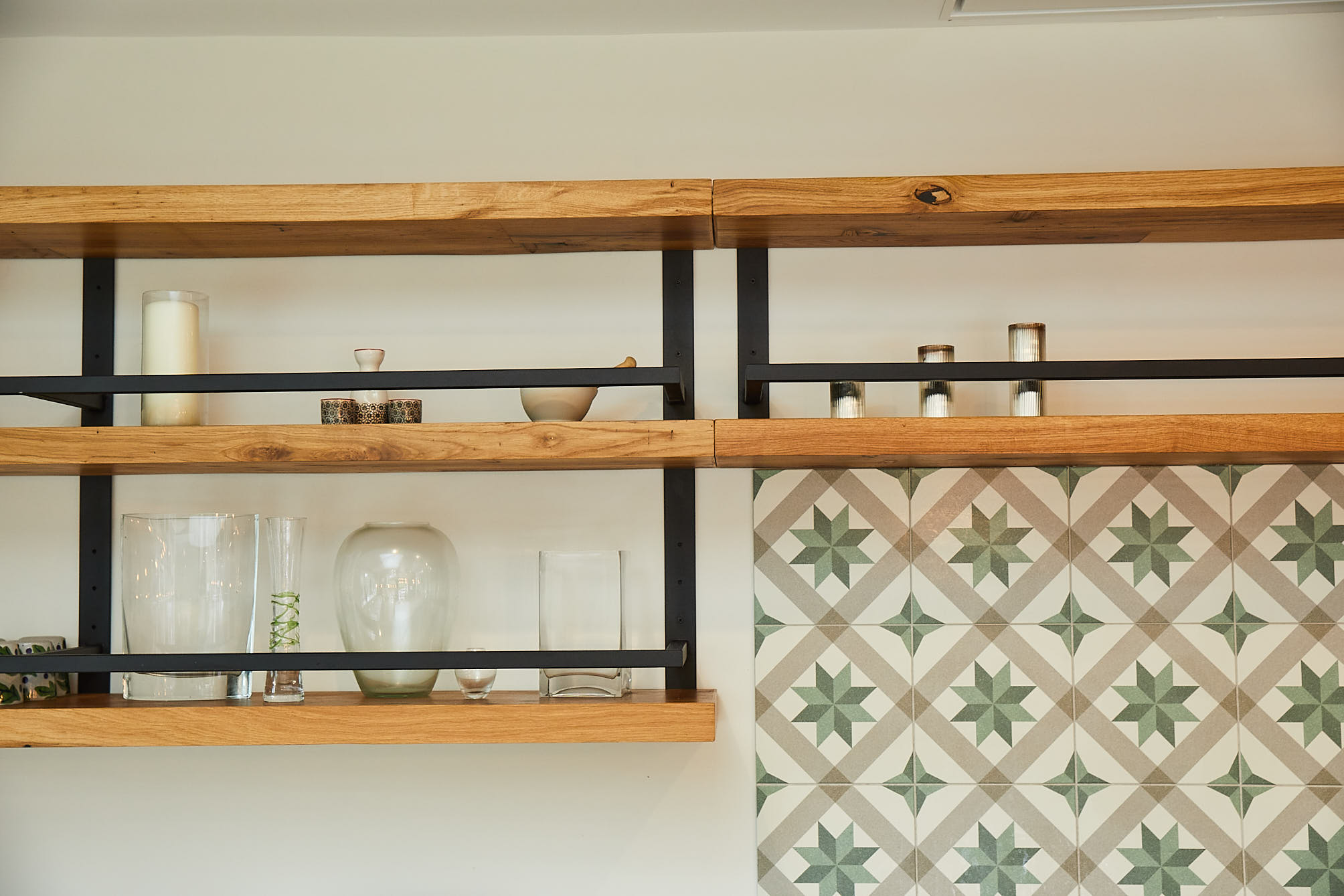 Floating chunky oak shelves with black powder coated frames