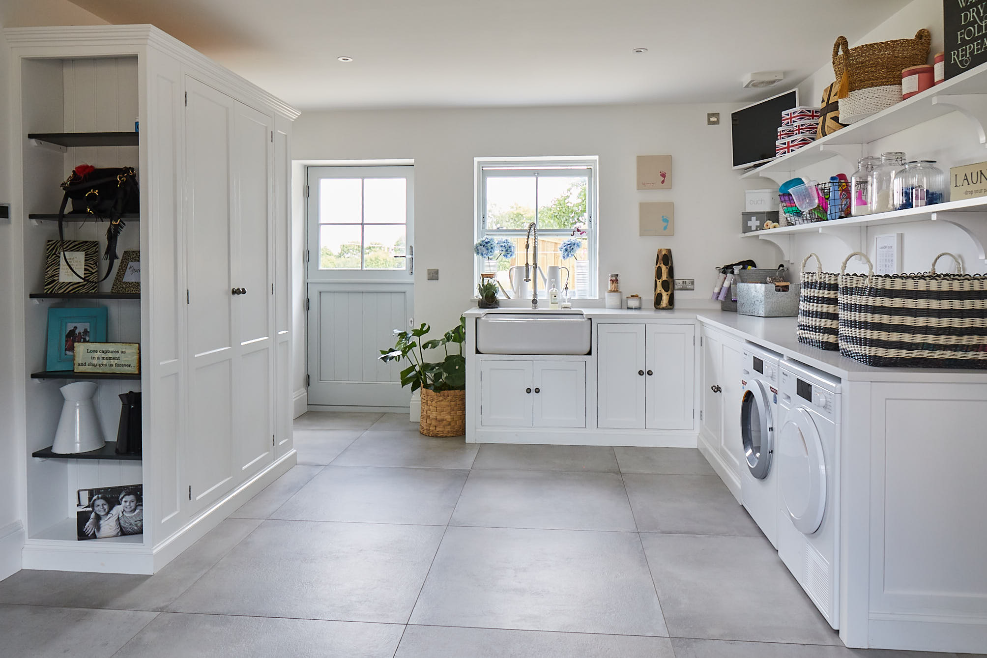 Bright white utility with large square porcelain tiles