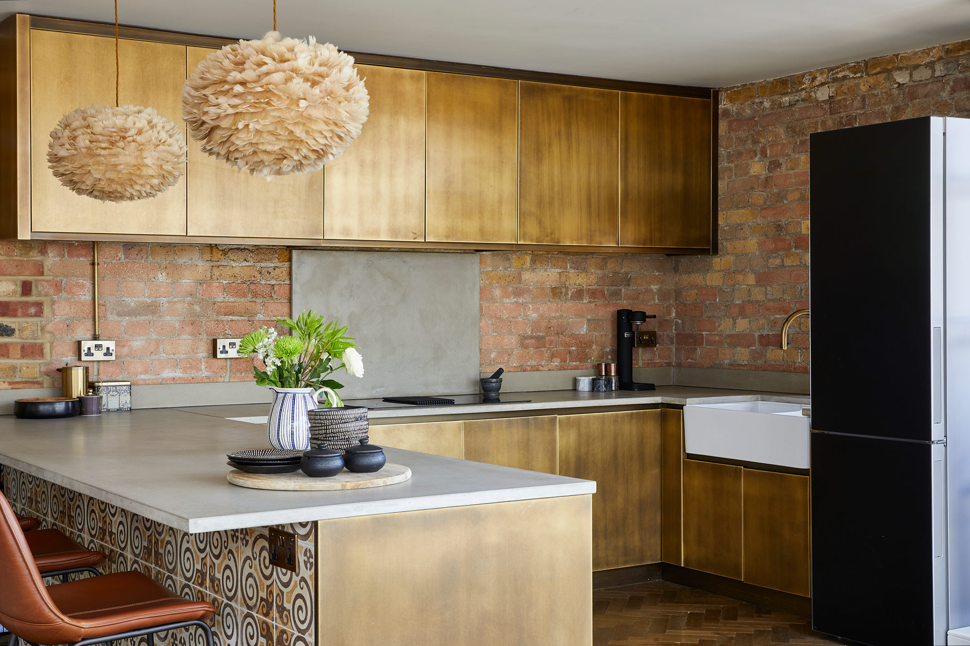 Bespoke metal brass kitchen with concrete worktops