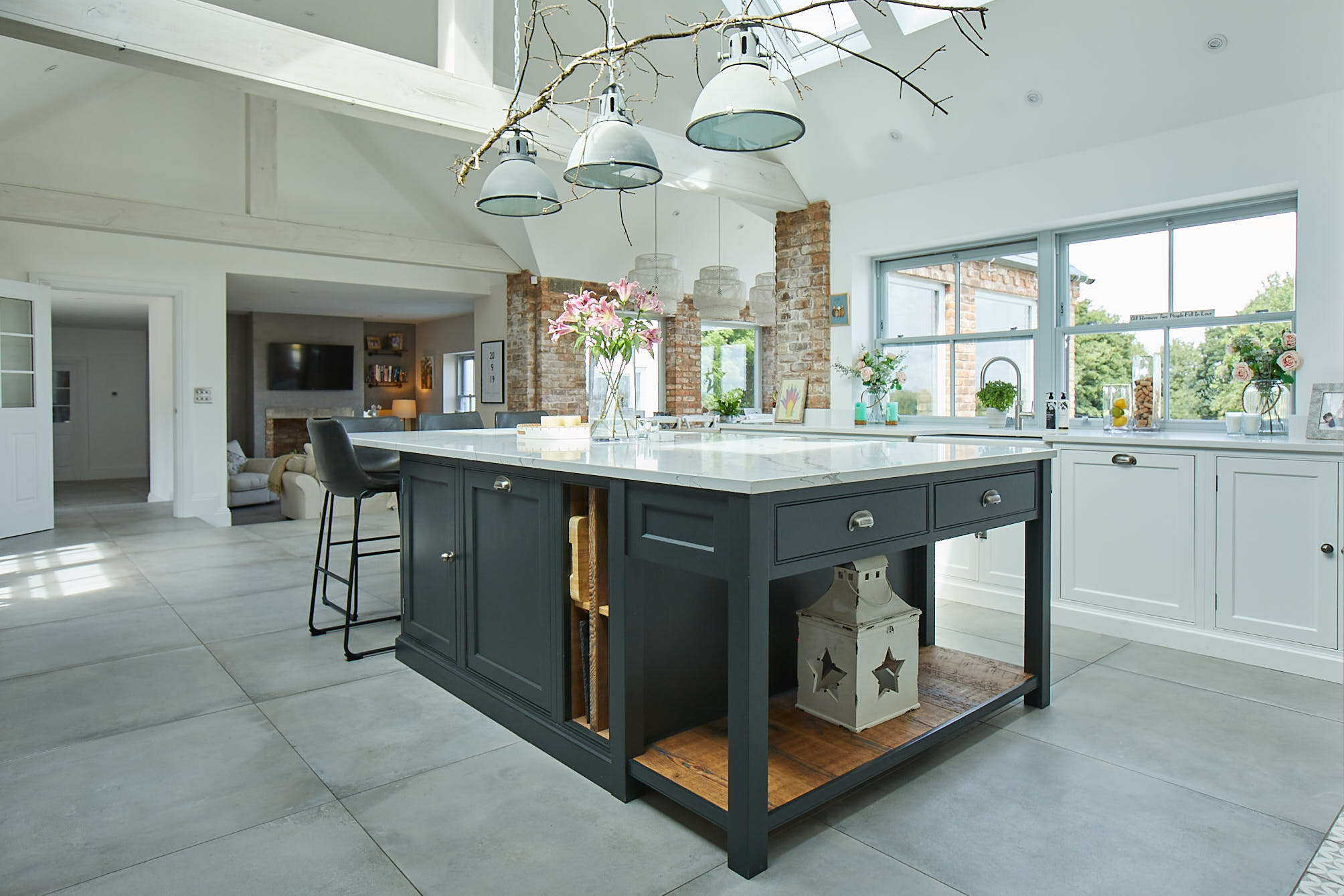 Black Bepoke island with white quartz worktop