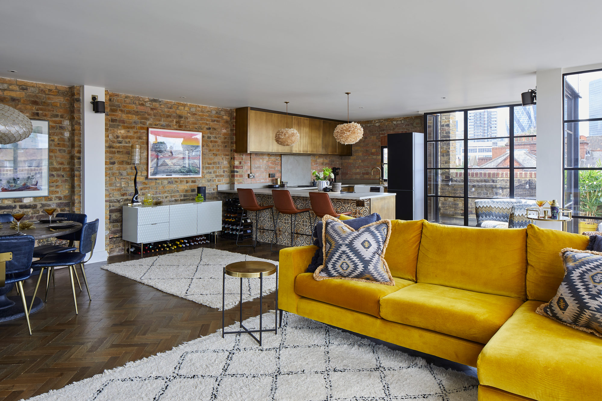 Bright yellow sofa in open plan living space