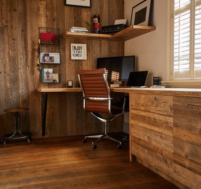 Home office with reclaimed cladding and industrial chair