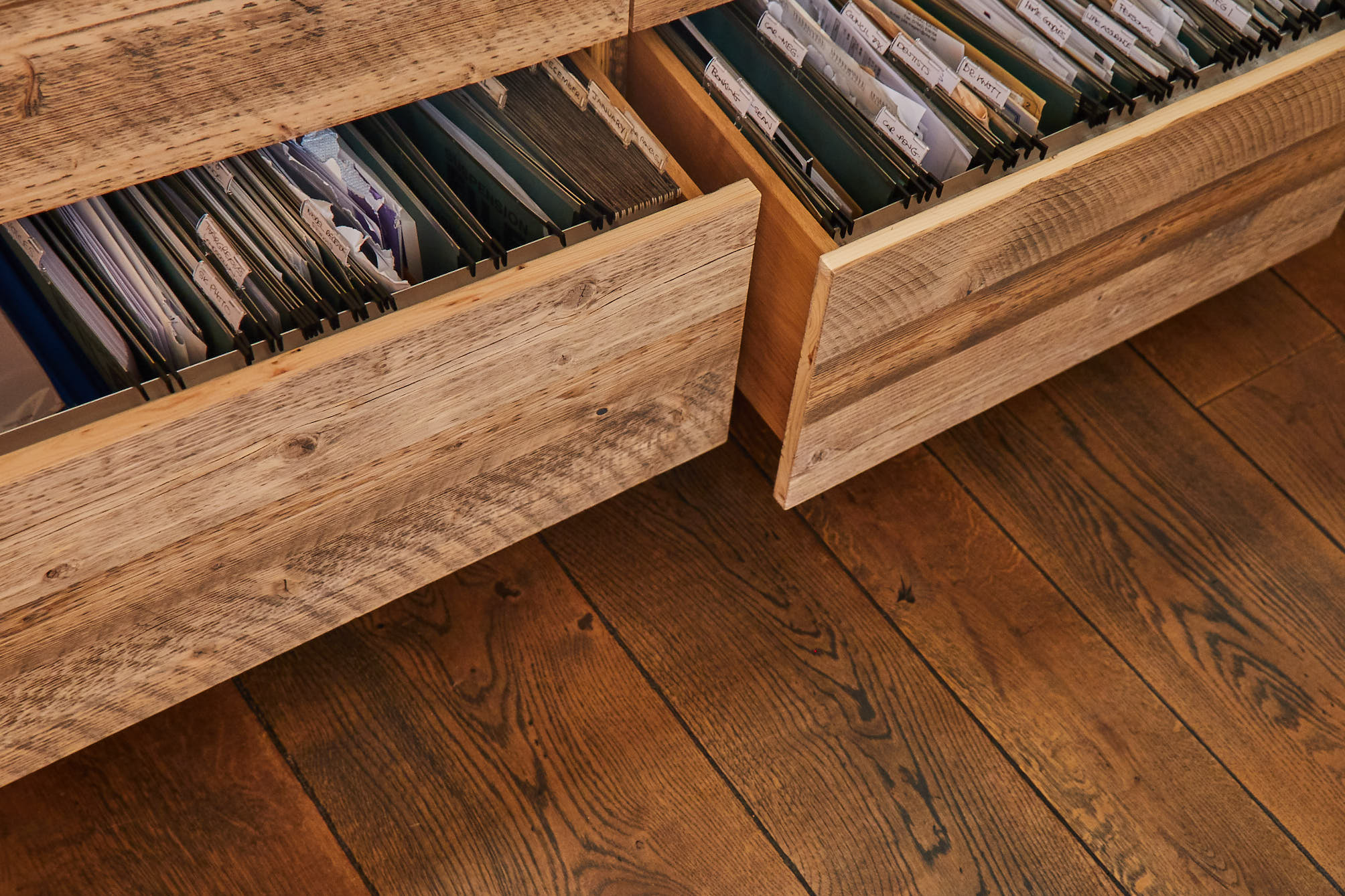 Rustic pine filing cabinets open