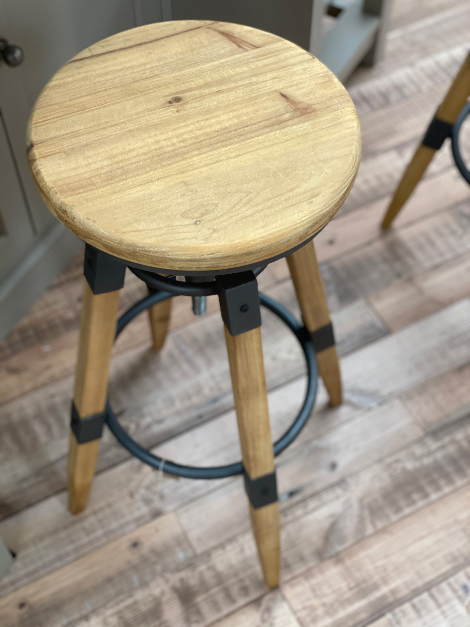 Wood seat on industrial barstool