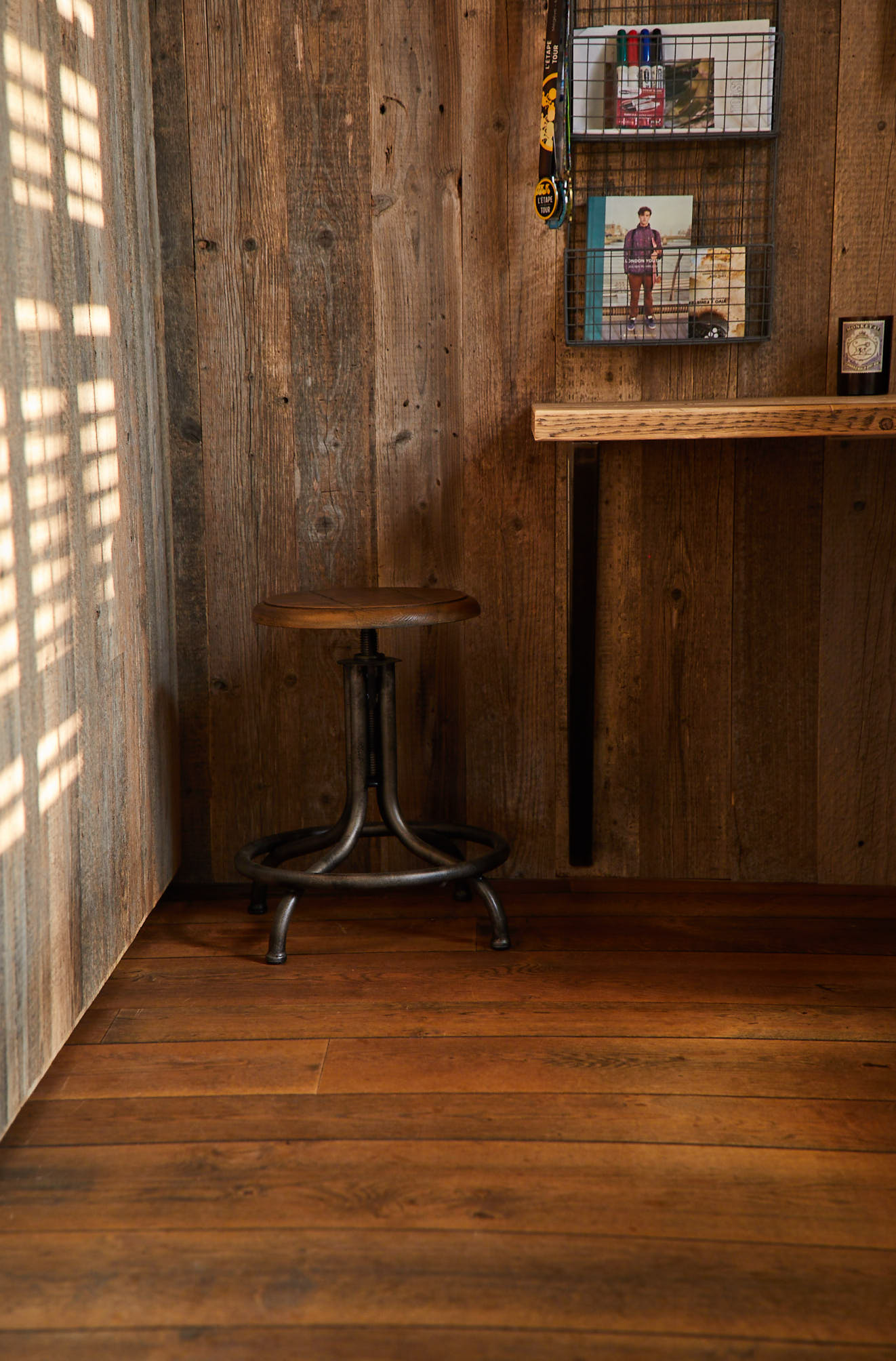 Industrial chair with iron base surrounded by reclaimed cladding