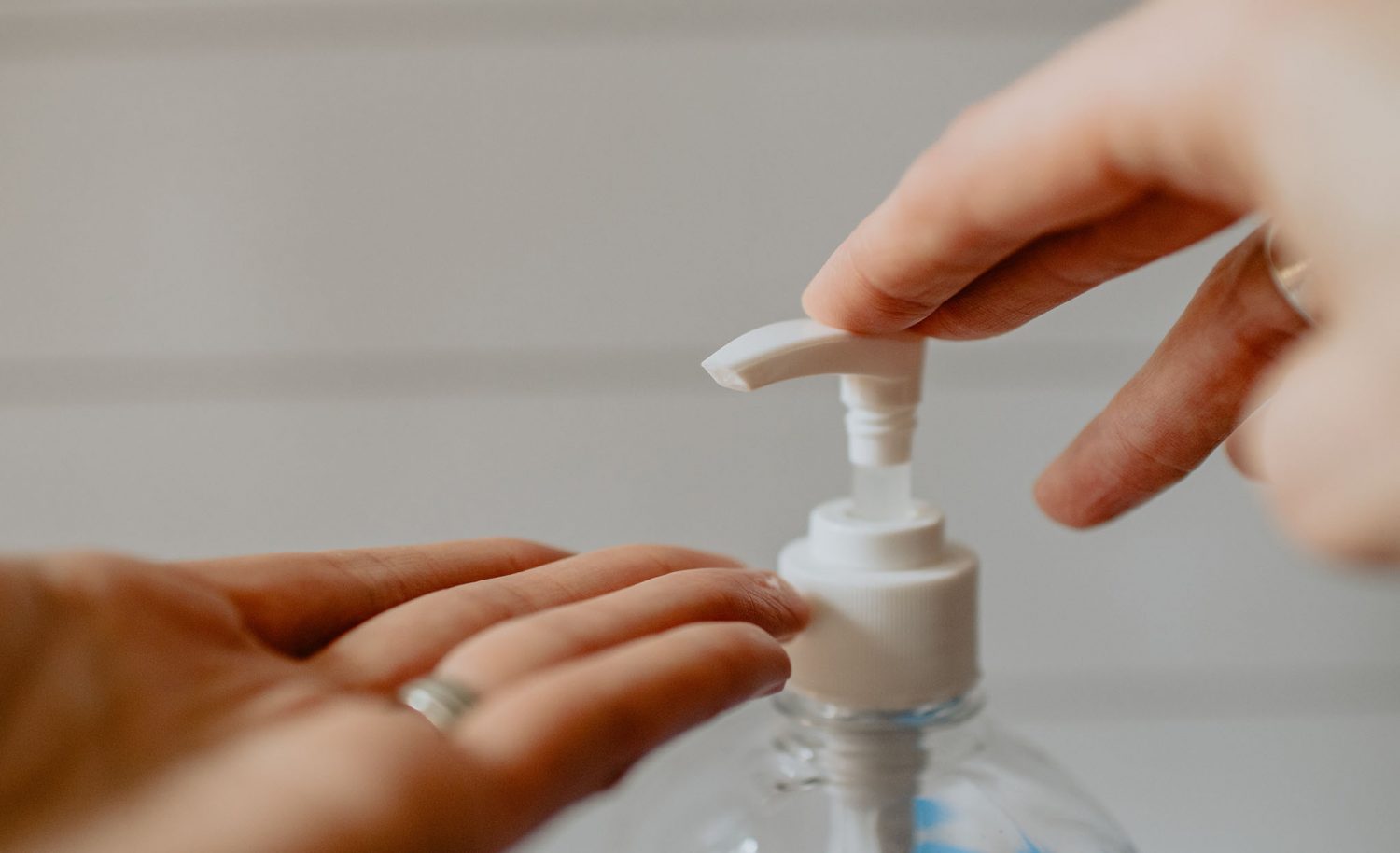 Lady Using Soap Pump Washing Hands