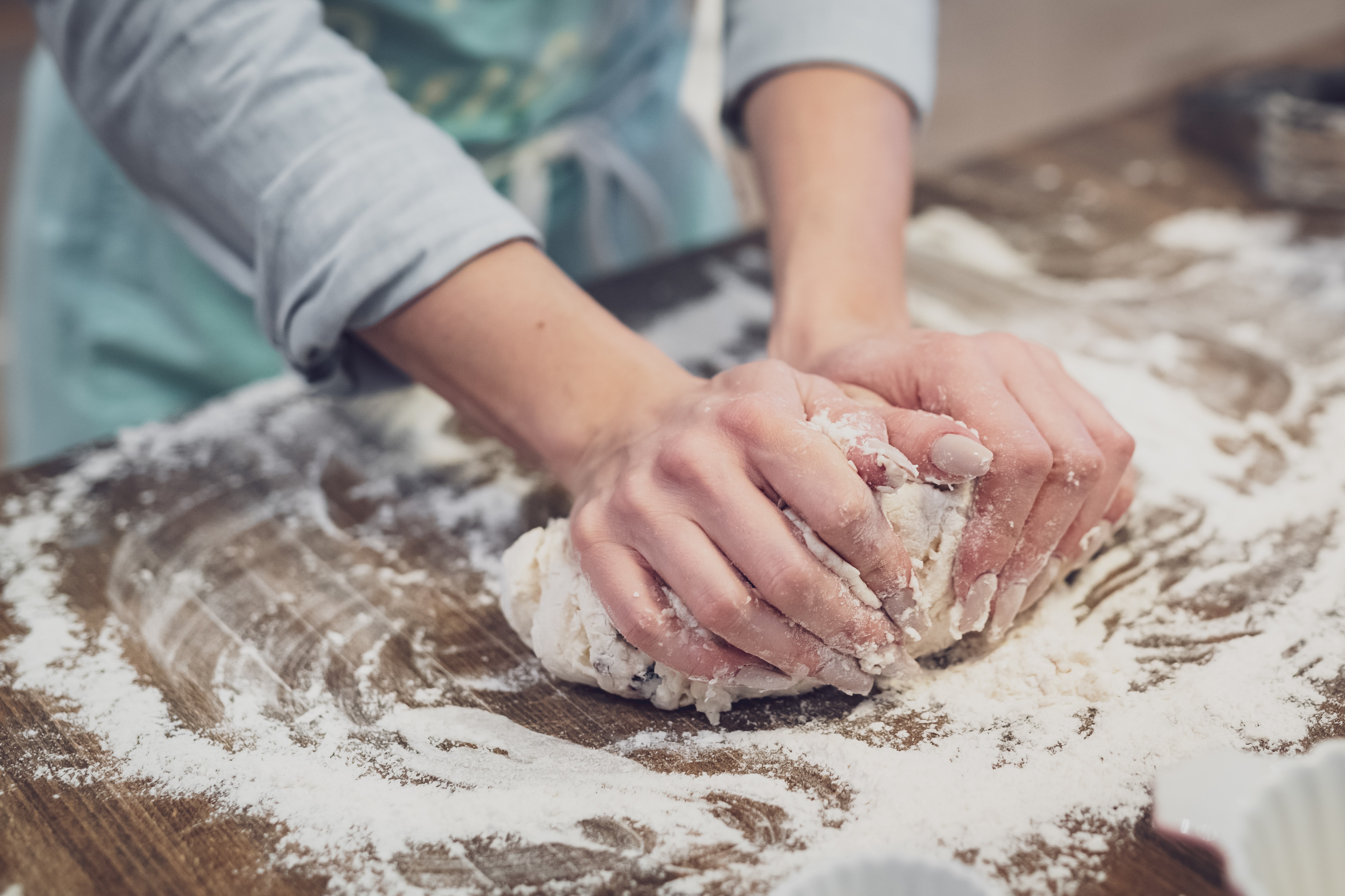 baker kneading bread