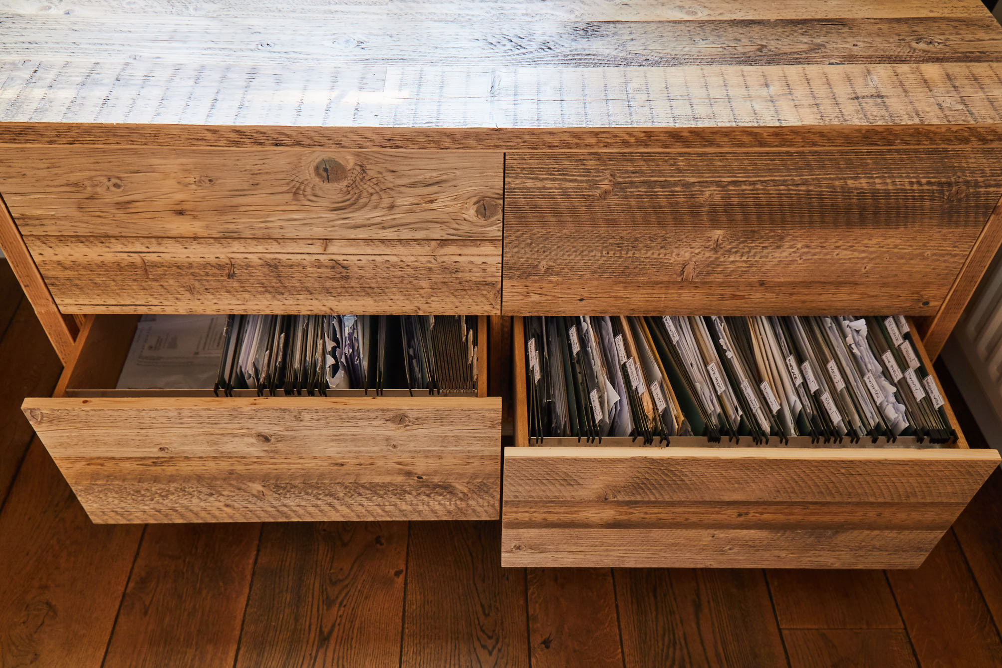 Rustic Filing cabinet drawers open with papers inside