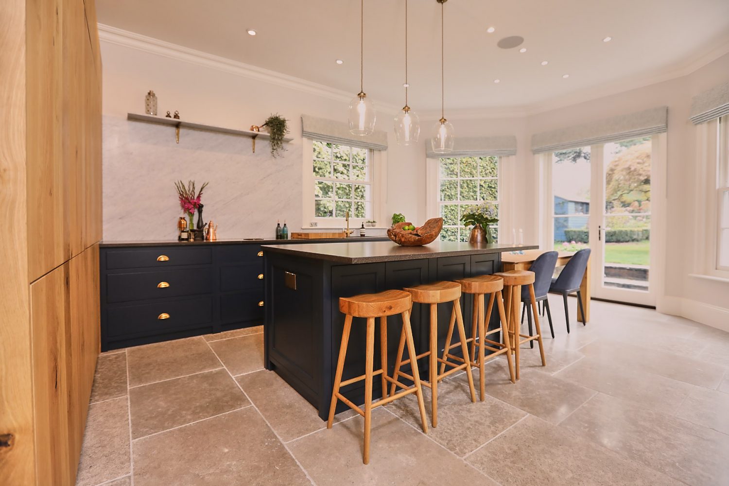 Oak barstools under Little Greene blue bespoke kitchen island