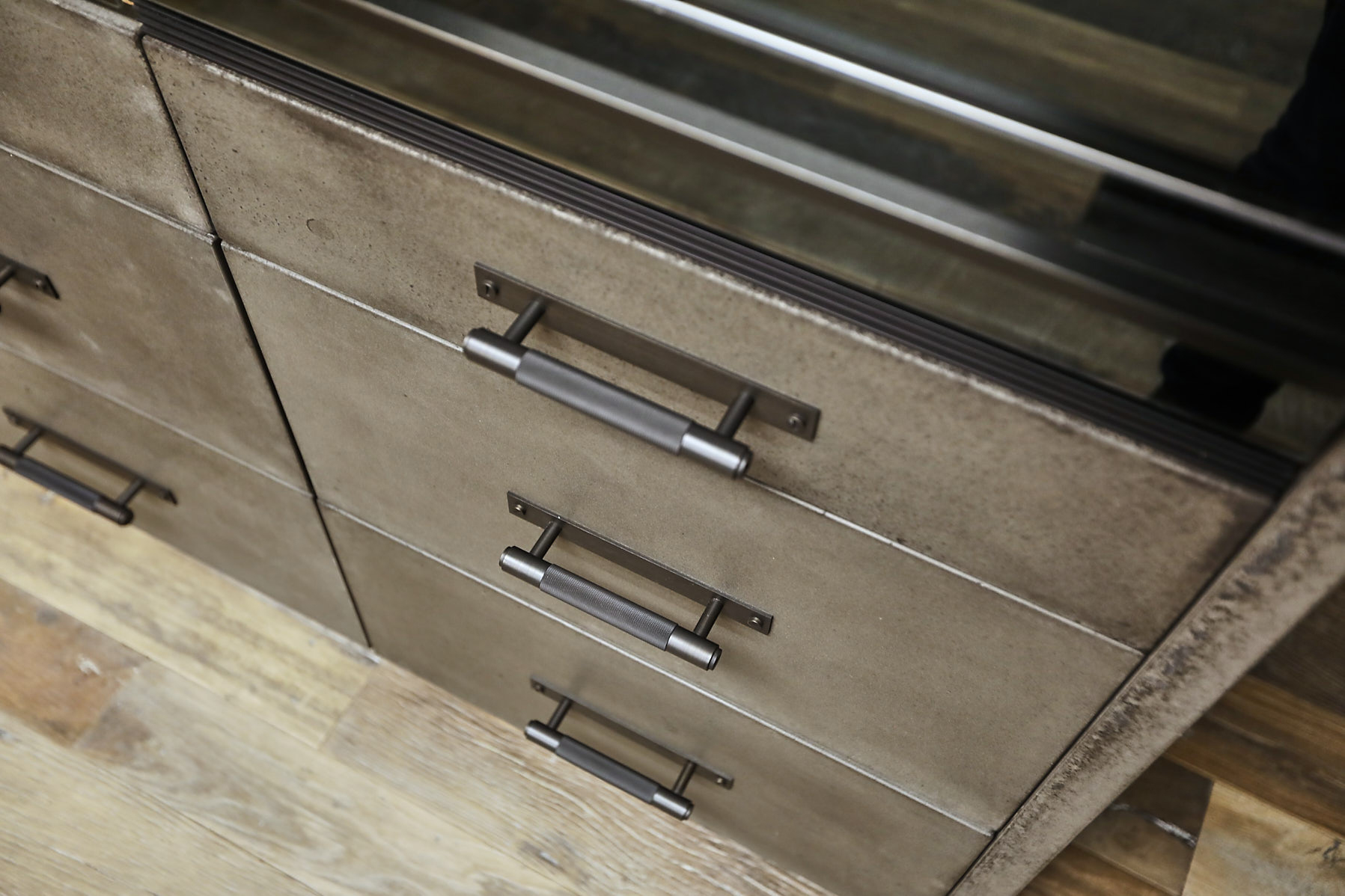 Solid concrete drawer fronts with buster and punch pull handles