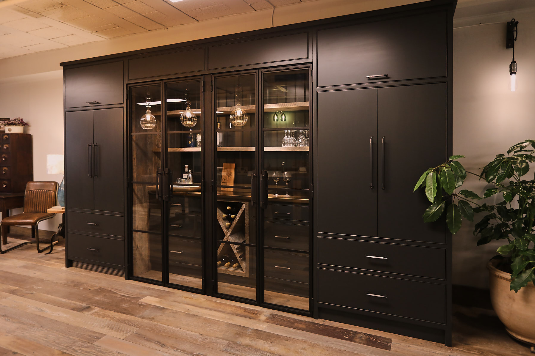 Tall kitchen cabinets painted in lamp black with crittall style doors