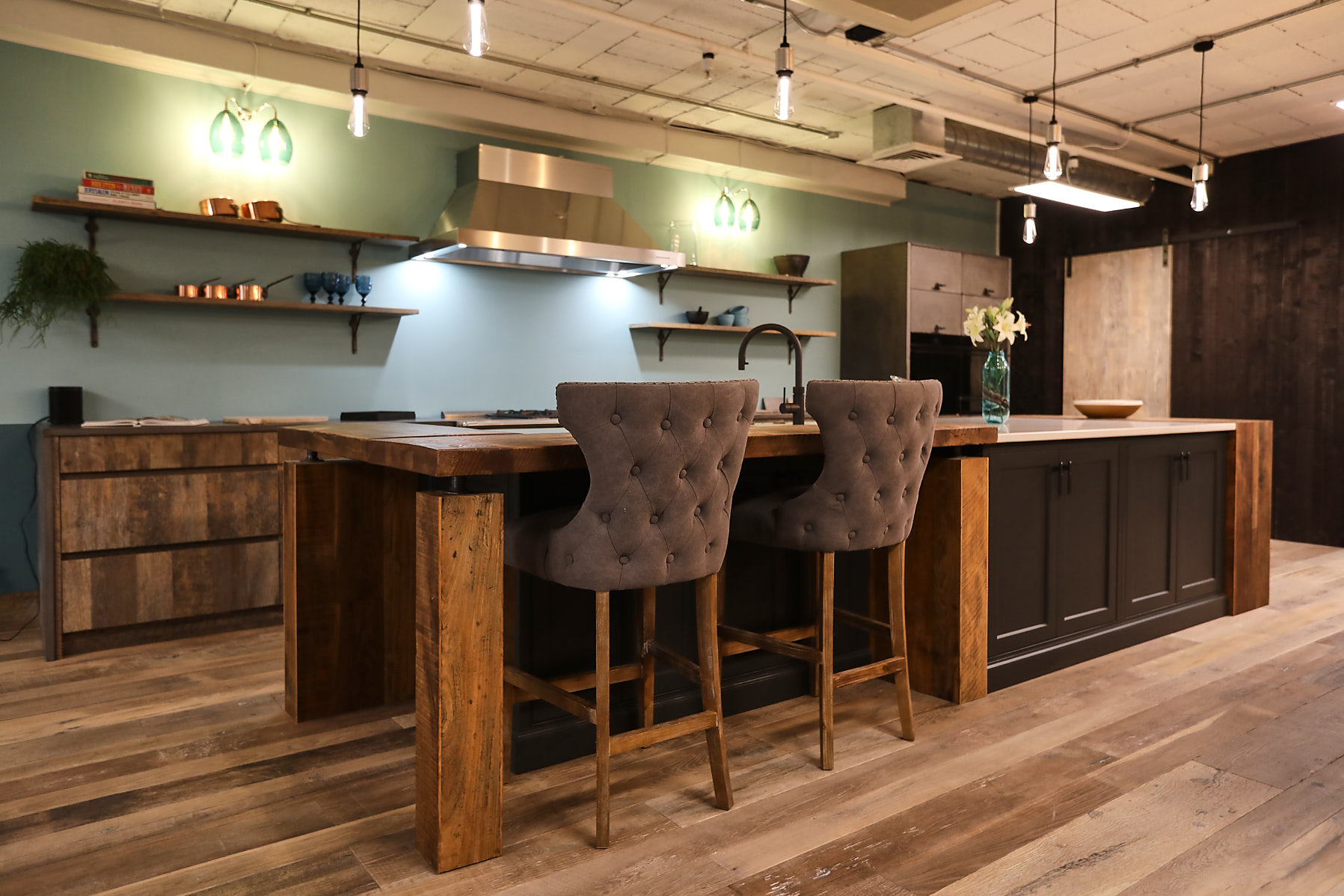 upholstered bar stools under bespoke rustic breakfast bar