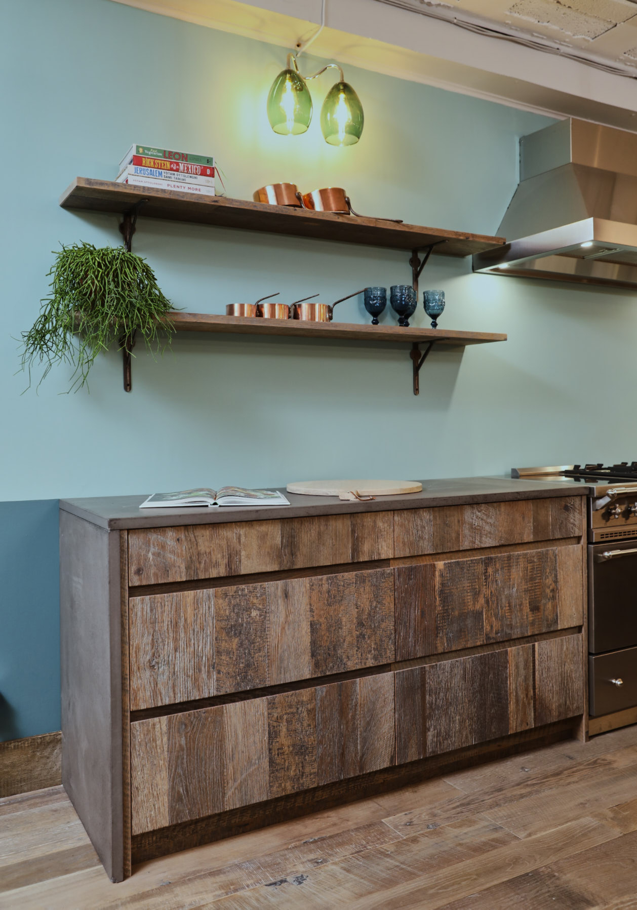 Reclaimed pan drawers with concrete kitchen worktop