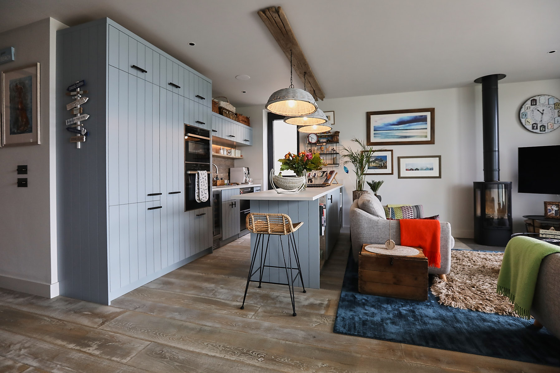 Bespoke blue kitchen island with reclaimed wood floor