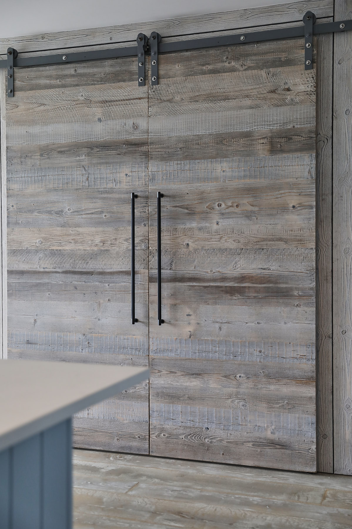Rustic barn sliding door with Buster and Punch handles