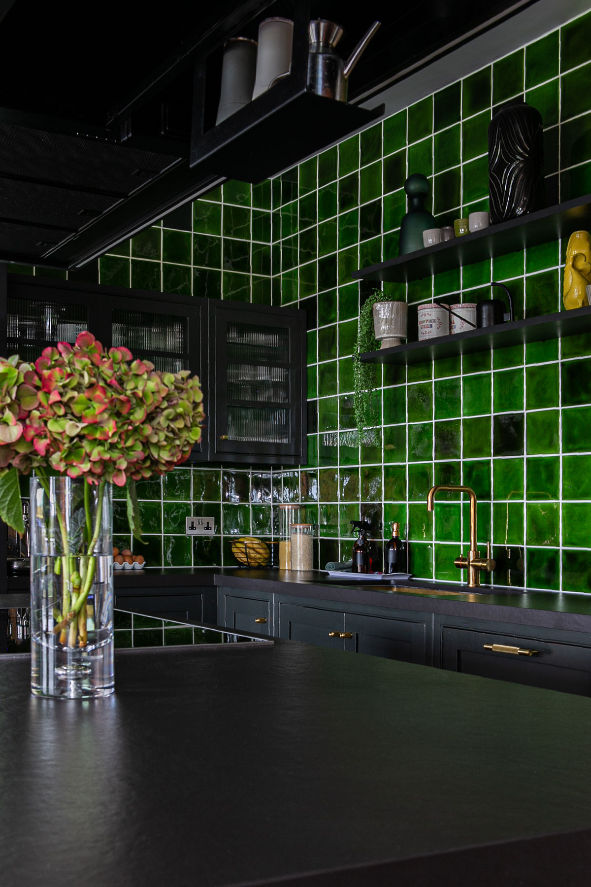 Green tiles make kitchen backsplash