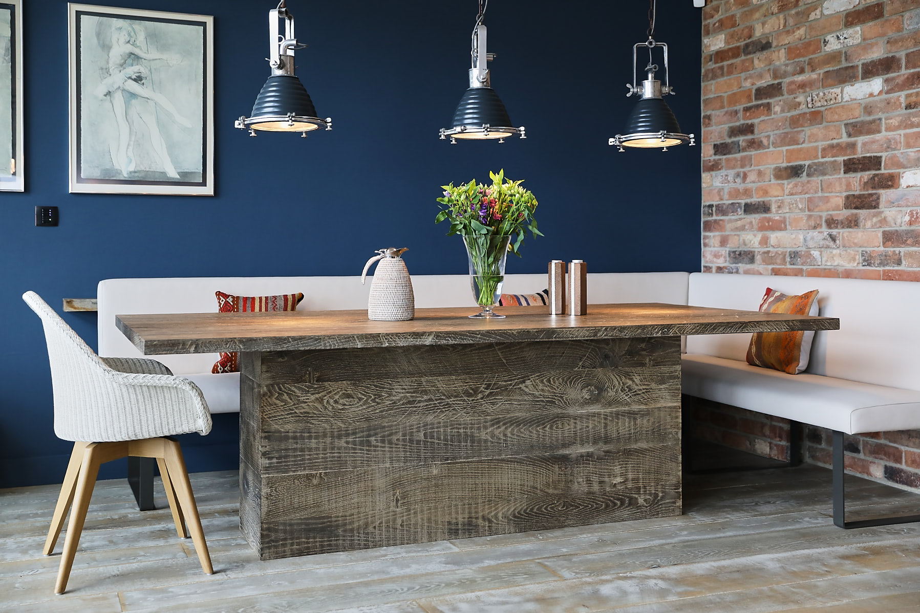 Oak dining table with blue wall