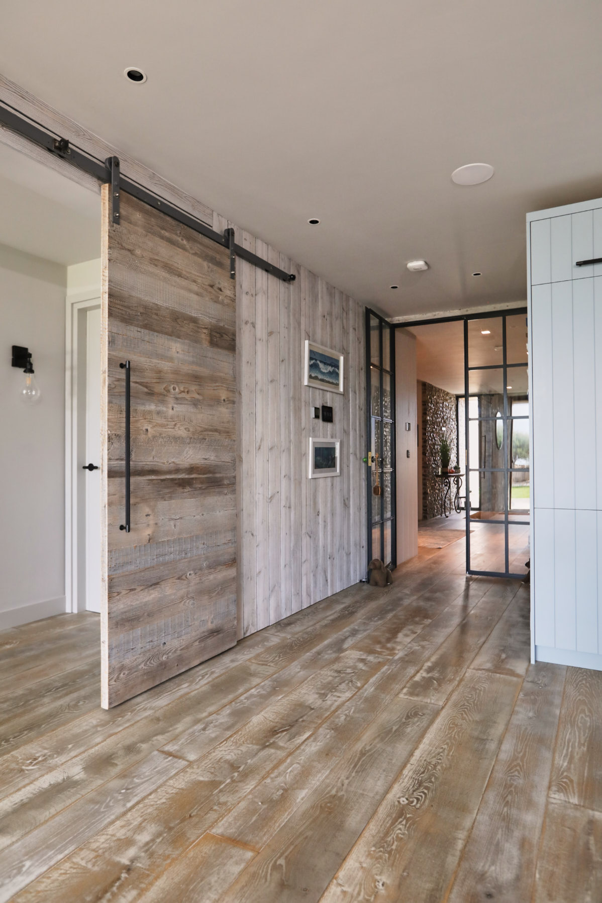 Open barn door with wooden flooring