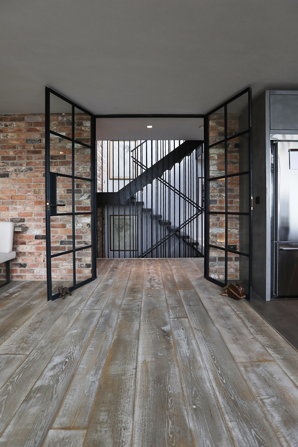 Black steel doors in entrance of kitchen