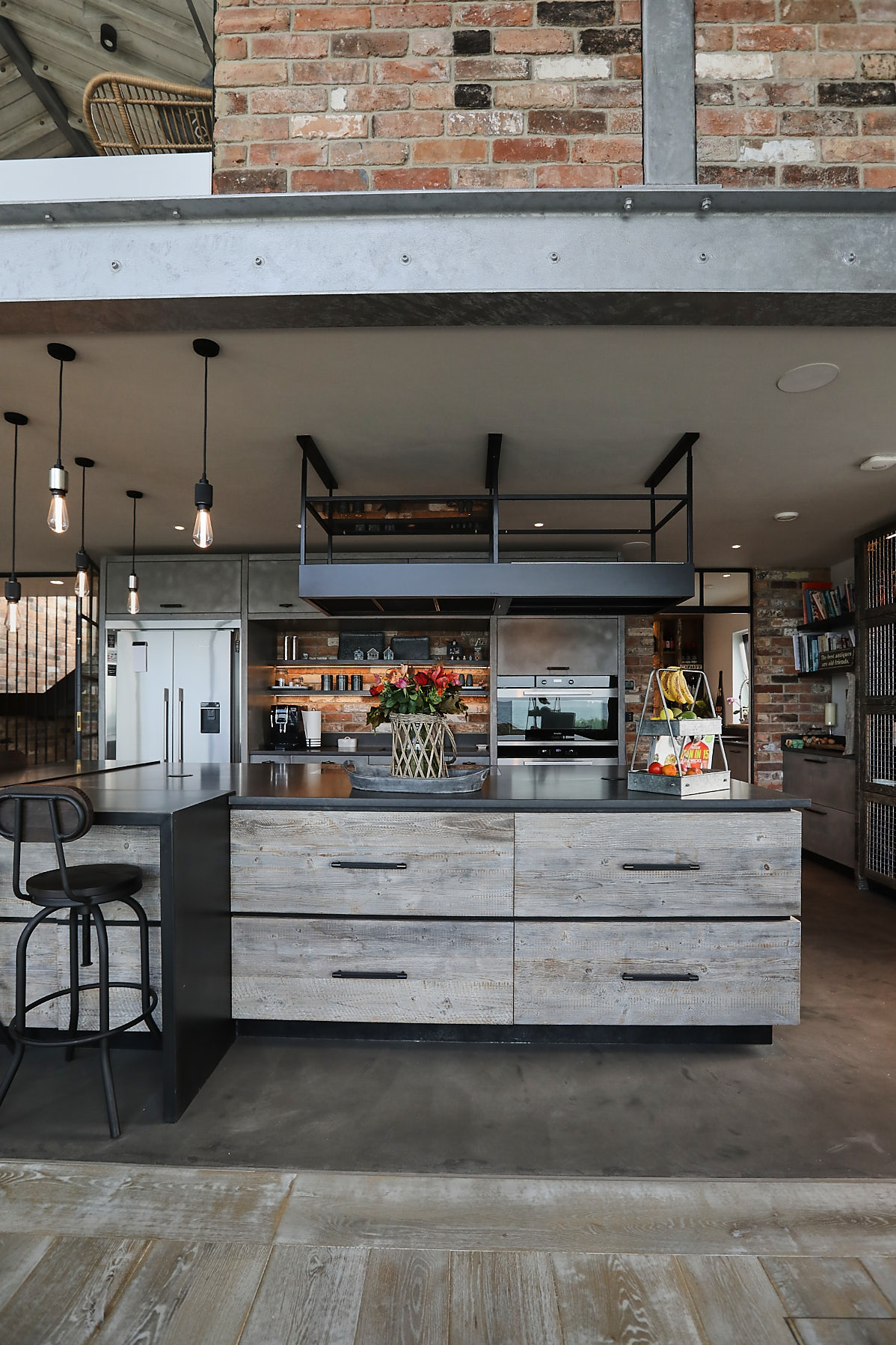 Reclaimed pan drawers with concrete kitchen worktop