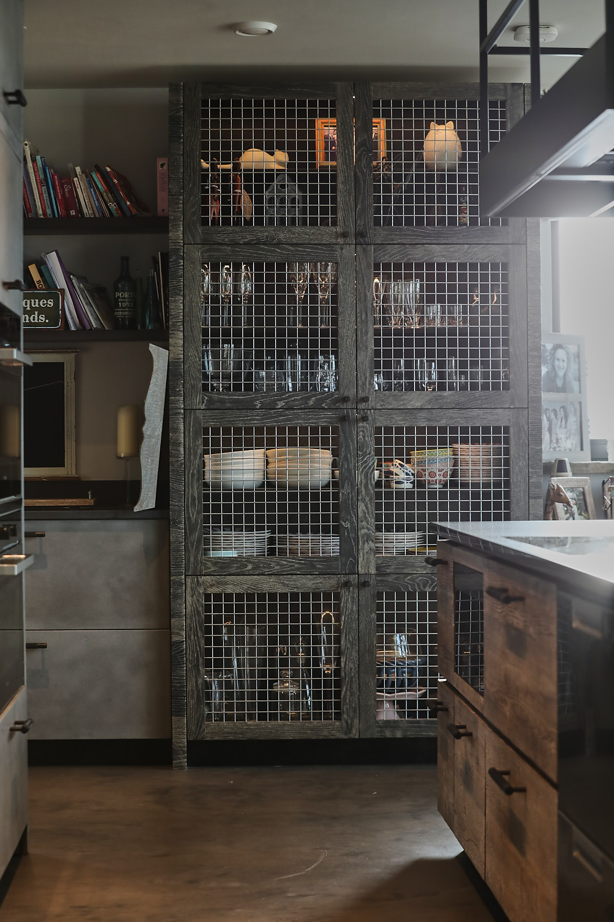 Wire and oak tall kitchen cabinet with concrete floor
