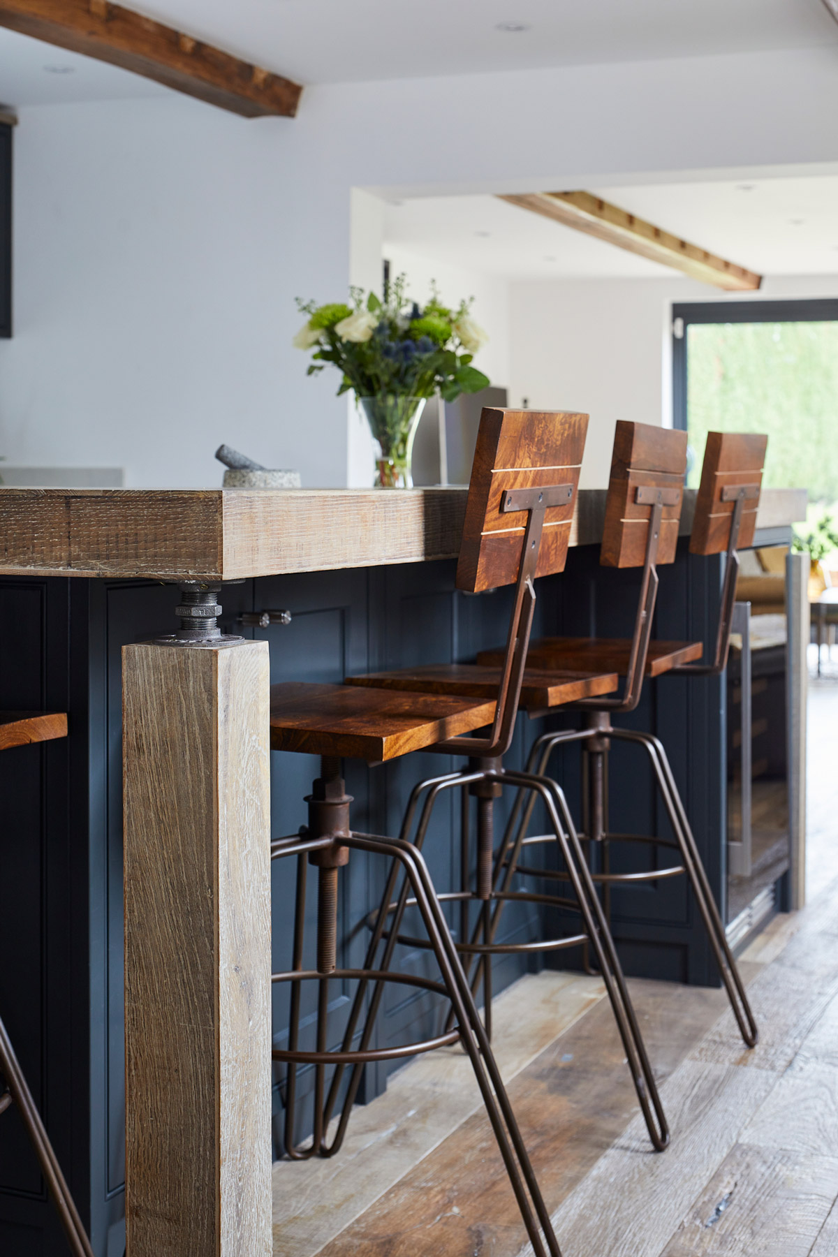 Industrial bar stool with wooden seat and backrest
