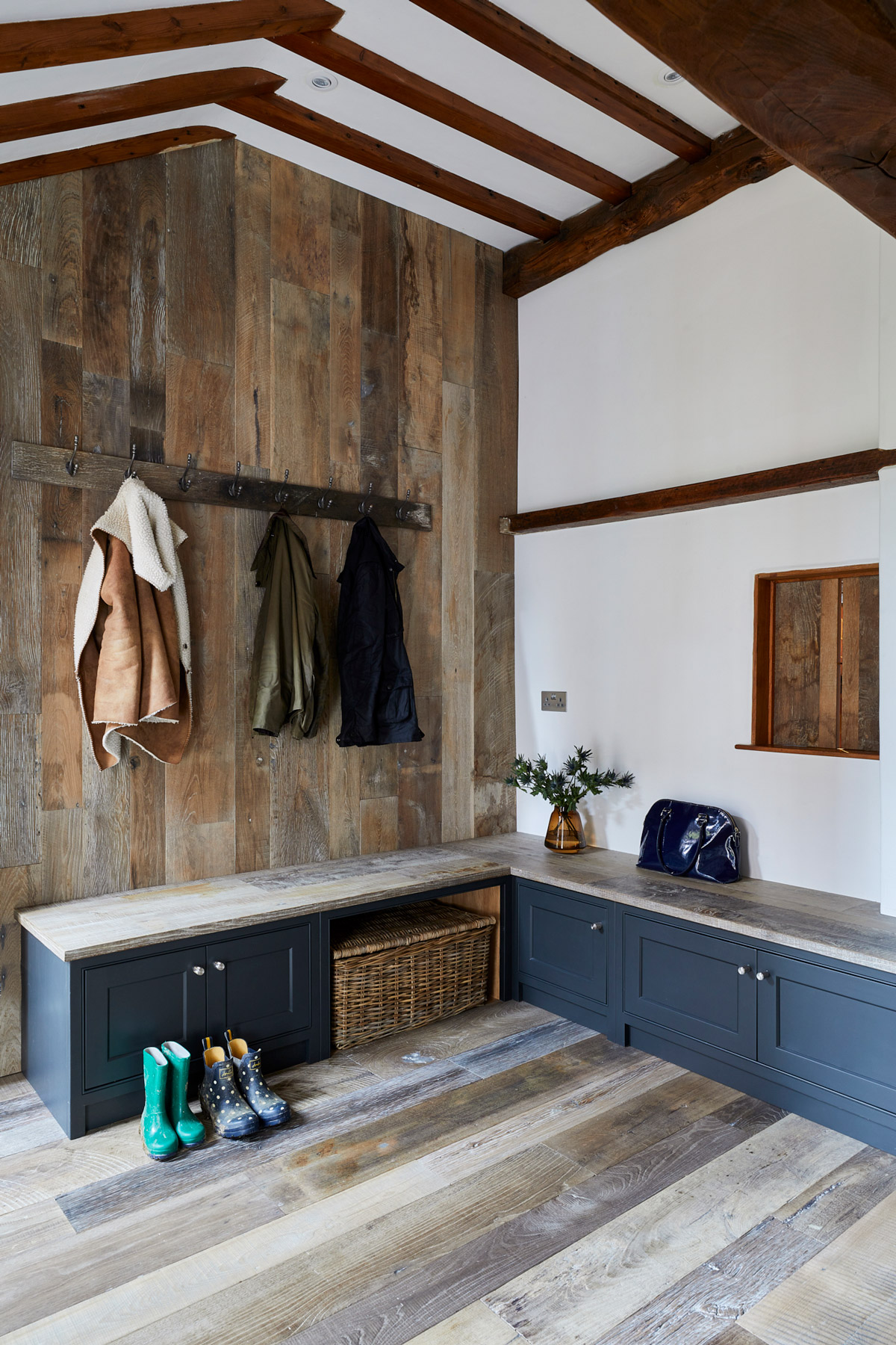 Boot cupboards with reclaimed oak seating and reclaimed oak cladded walls