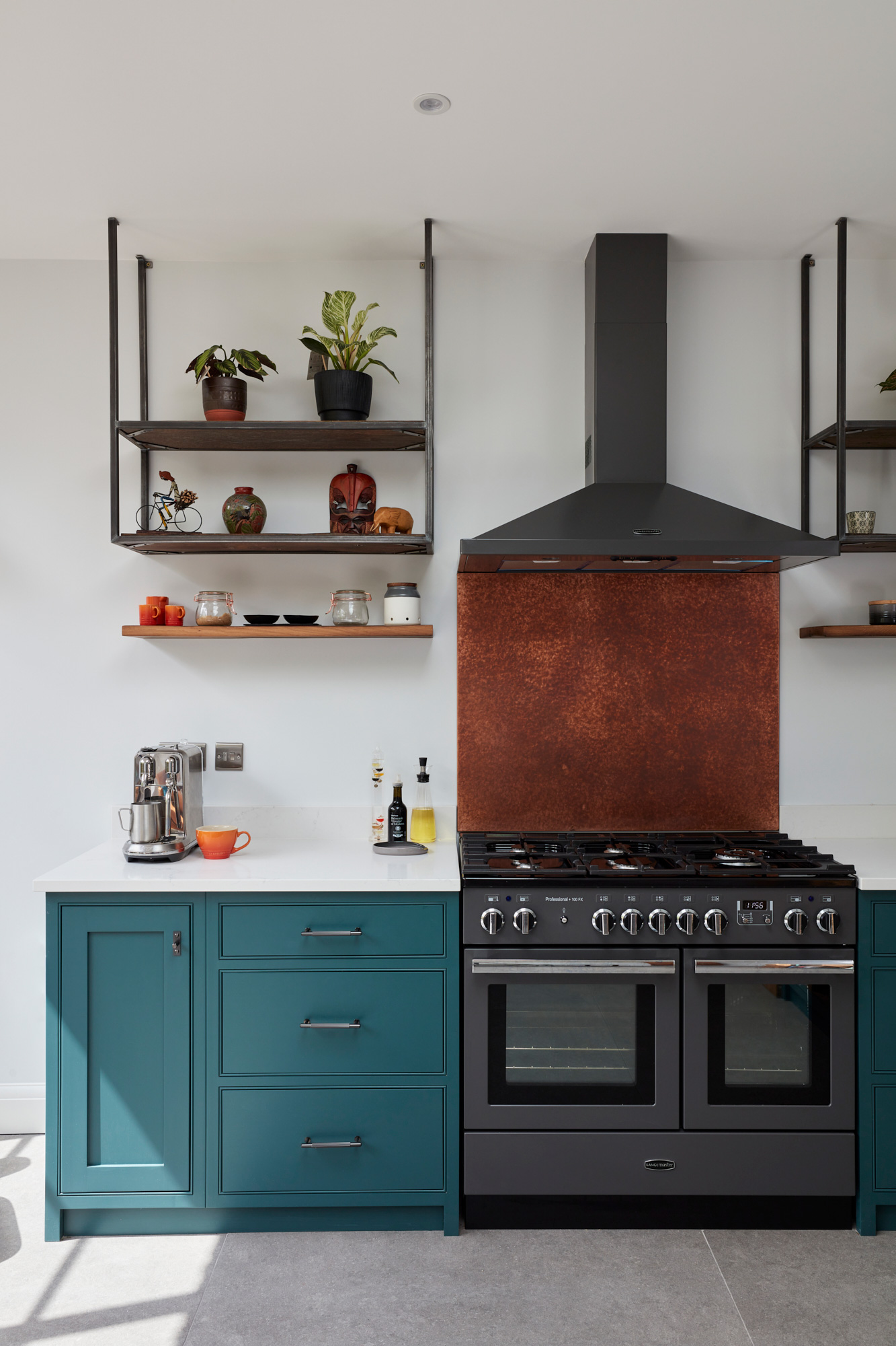 Copper backsplash and open industrial shelves in bespoke painted kitchen