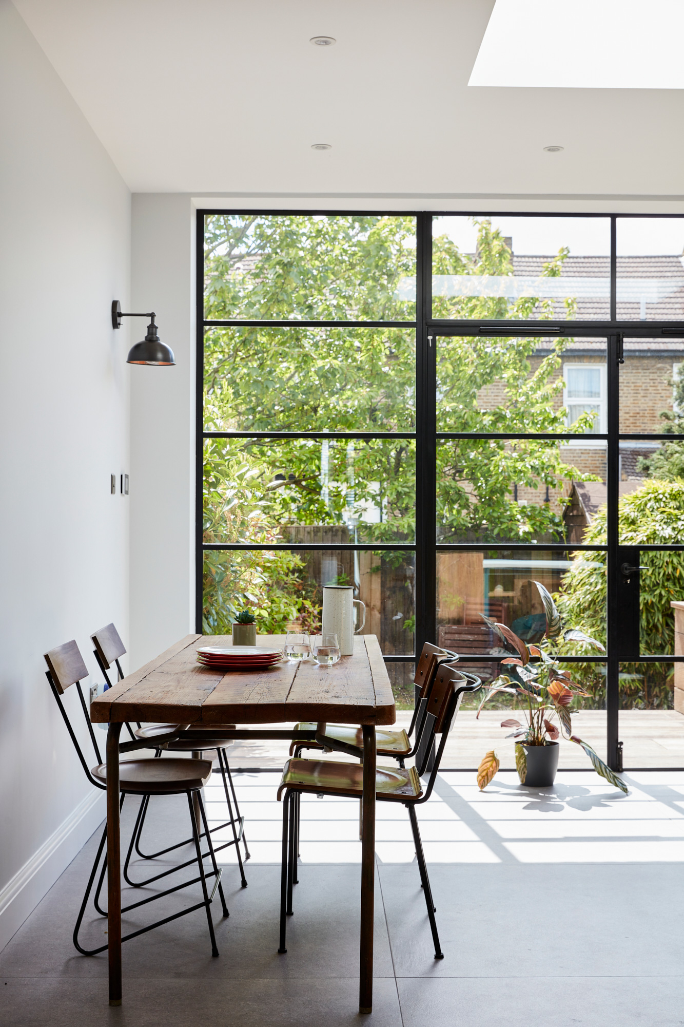 Crittall style doors with reclaimed oak kitchen table