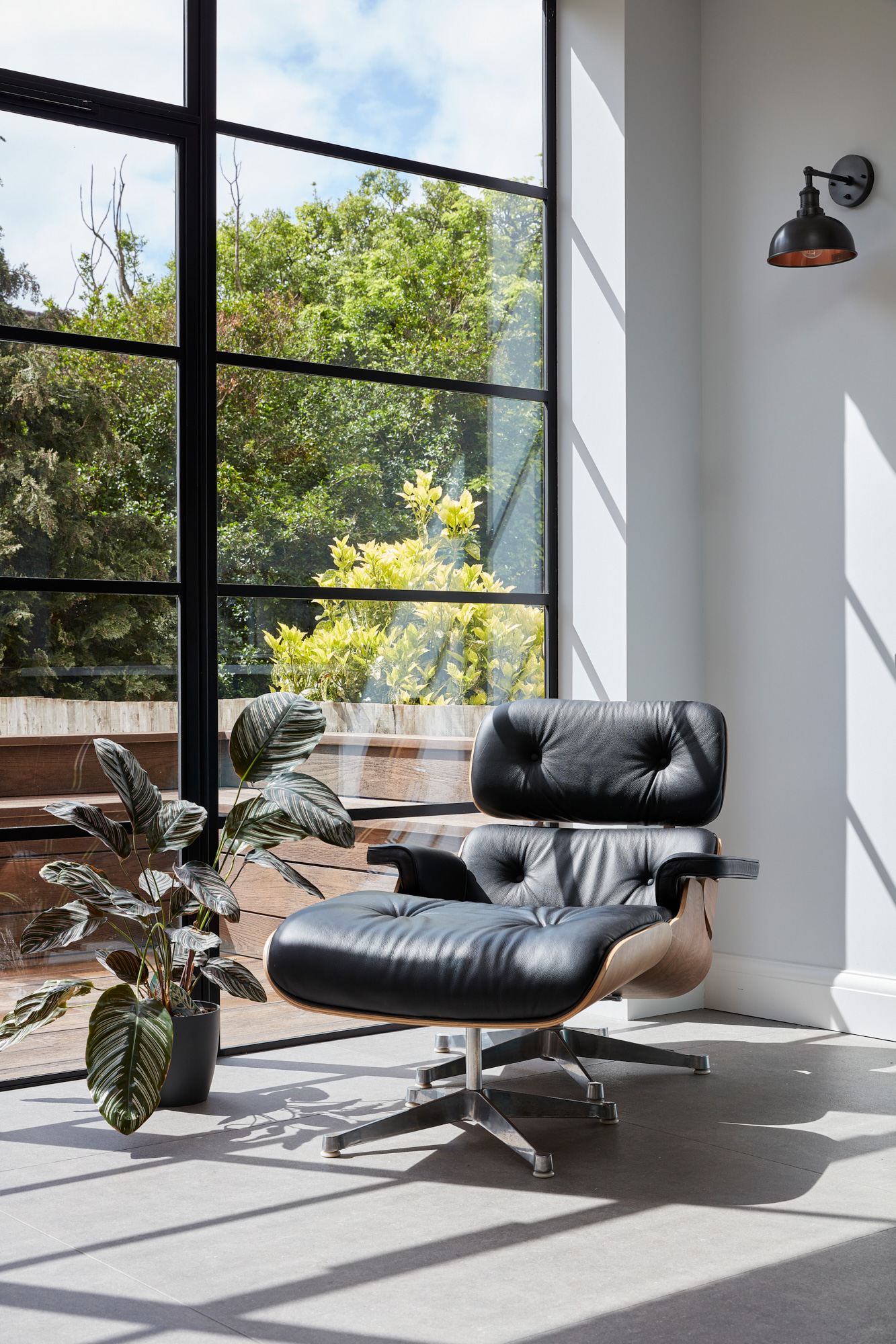eames leather chair with crittall style windows