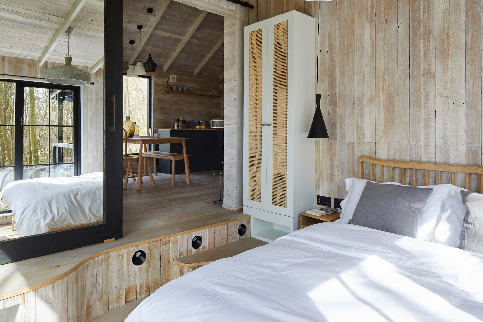 Bedroom cladded in reclaimed timber