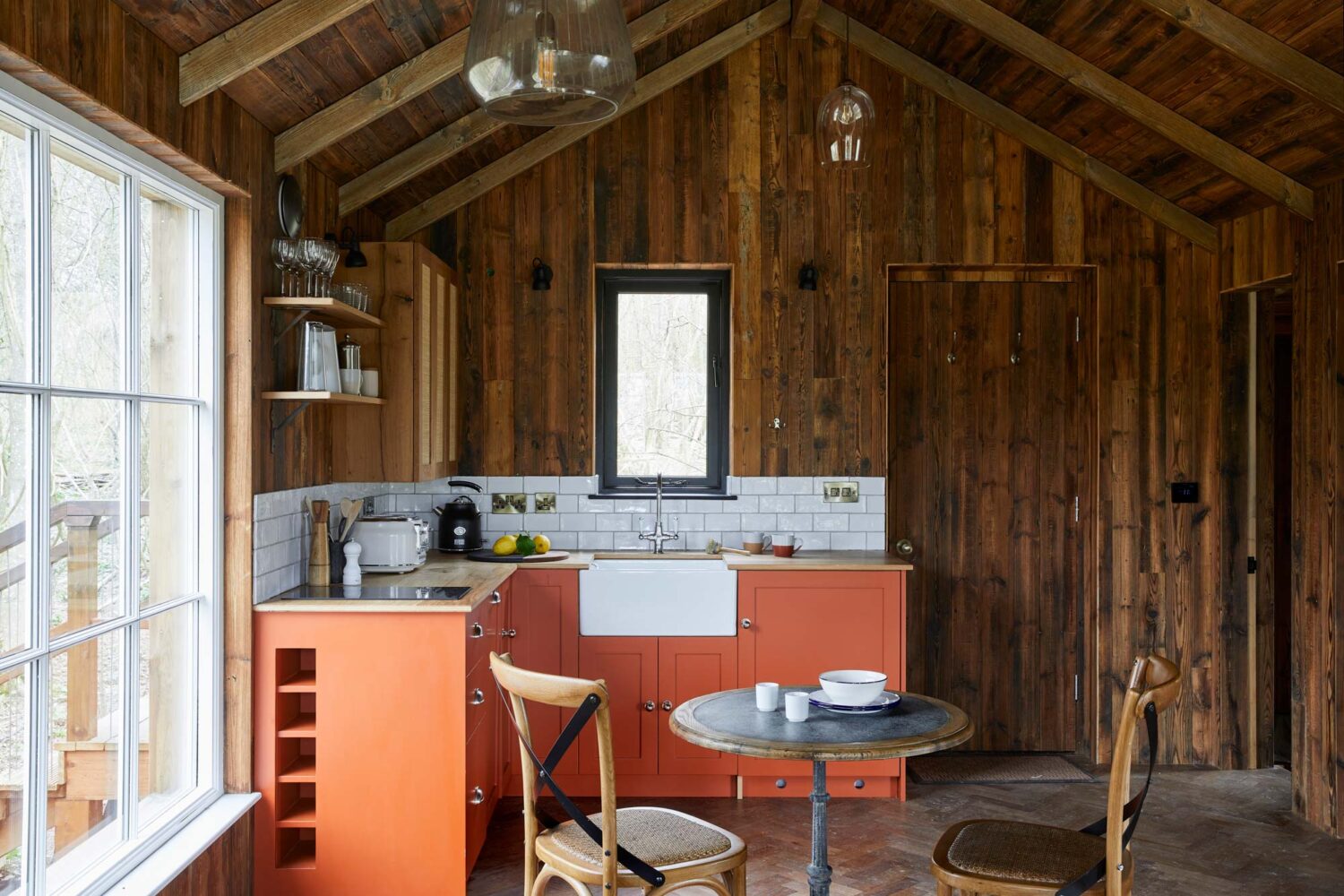 Open plan rustic treehouse kitchen