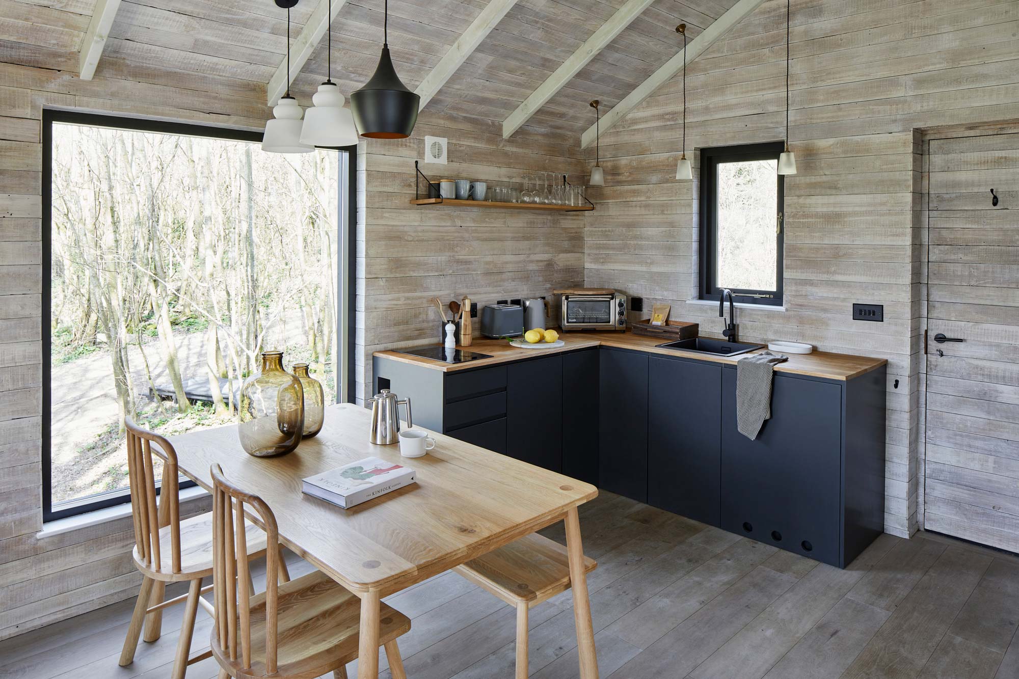 Reclaimed cladded treehouse kitchen