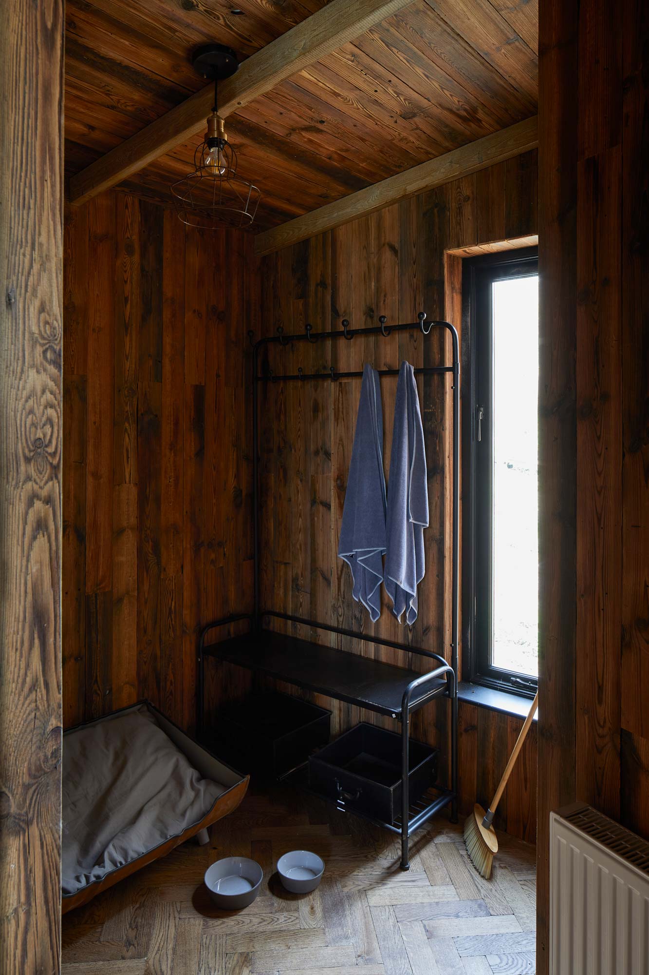 Reclaimed cladding and parquet flooring in bespoke treehouse