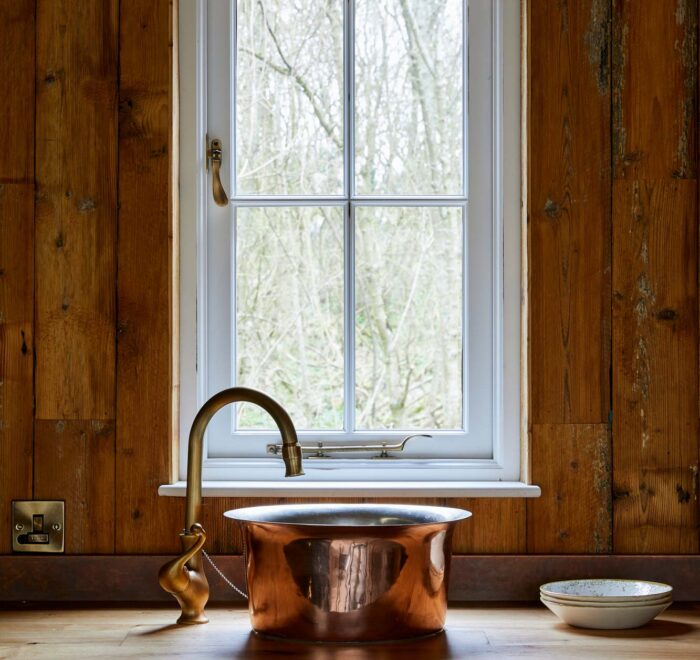 Reclaimed mill pine cladding in treehouse kitchen