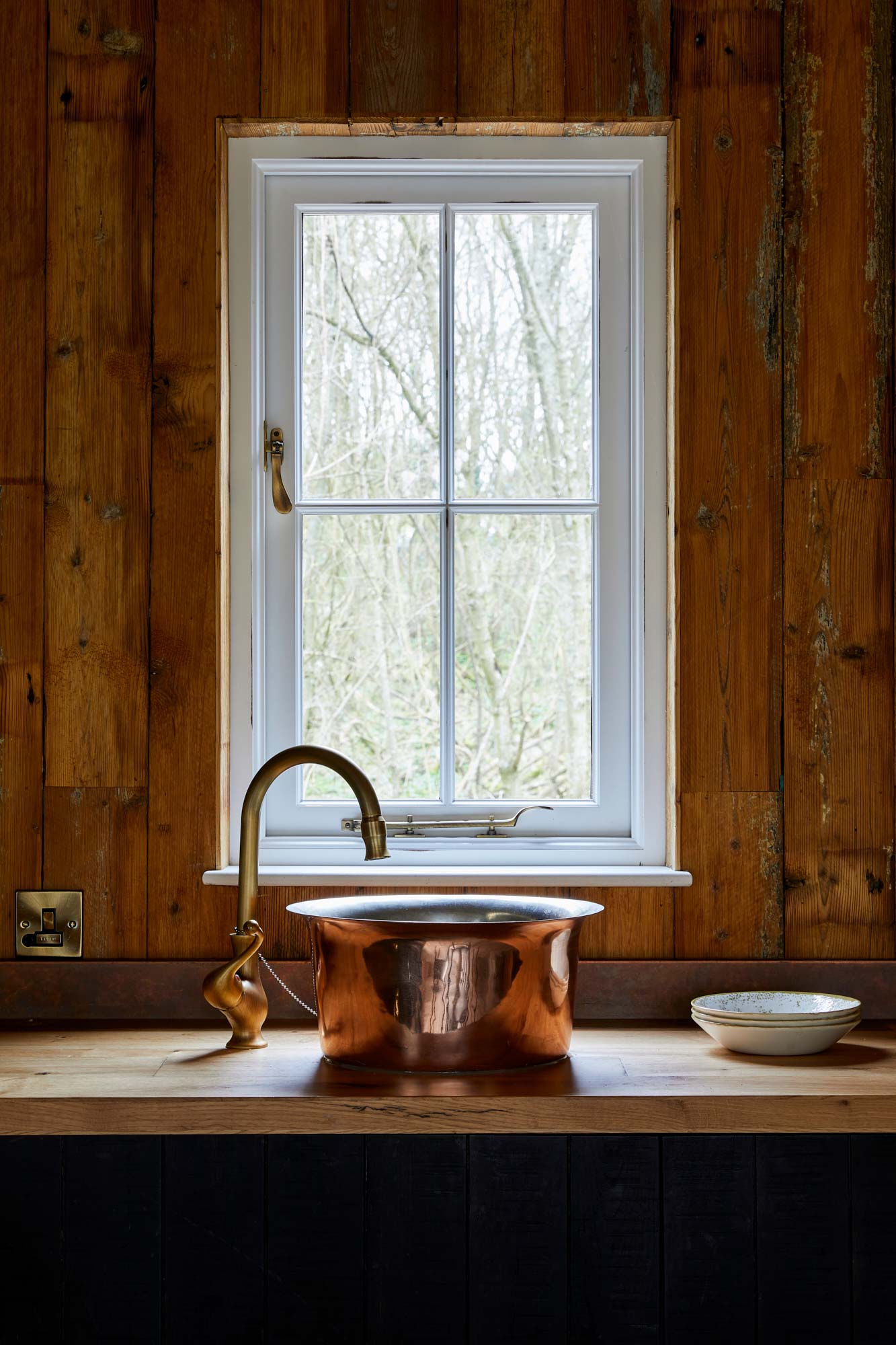 Reclaimed mill pine cladding in treehouse kitchen