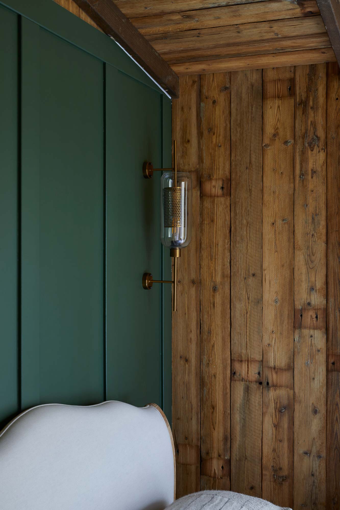 Rustic wall cladding in treehouse bedroom