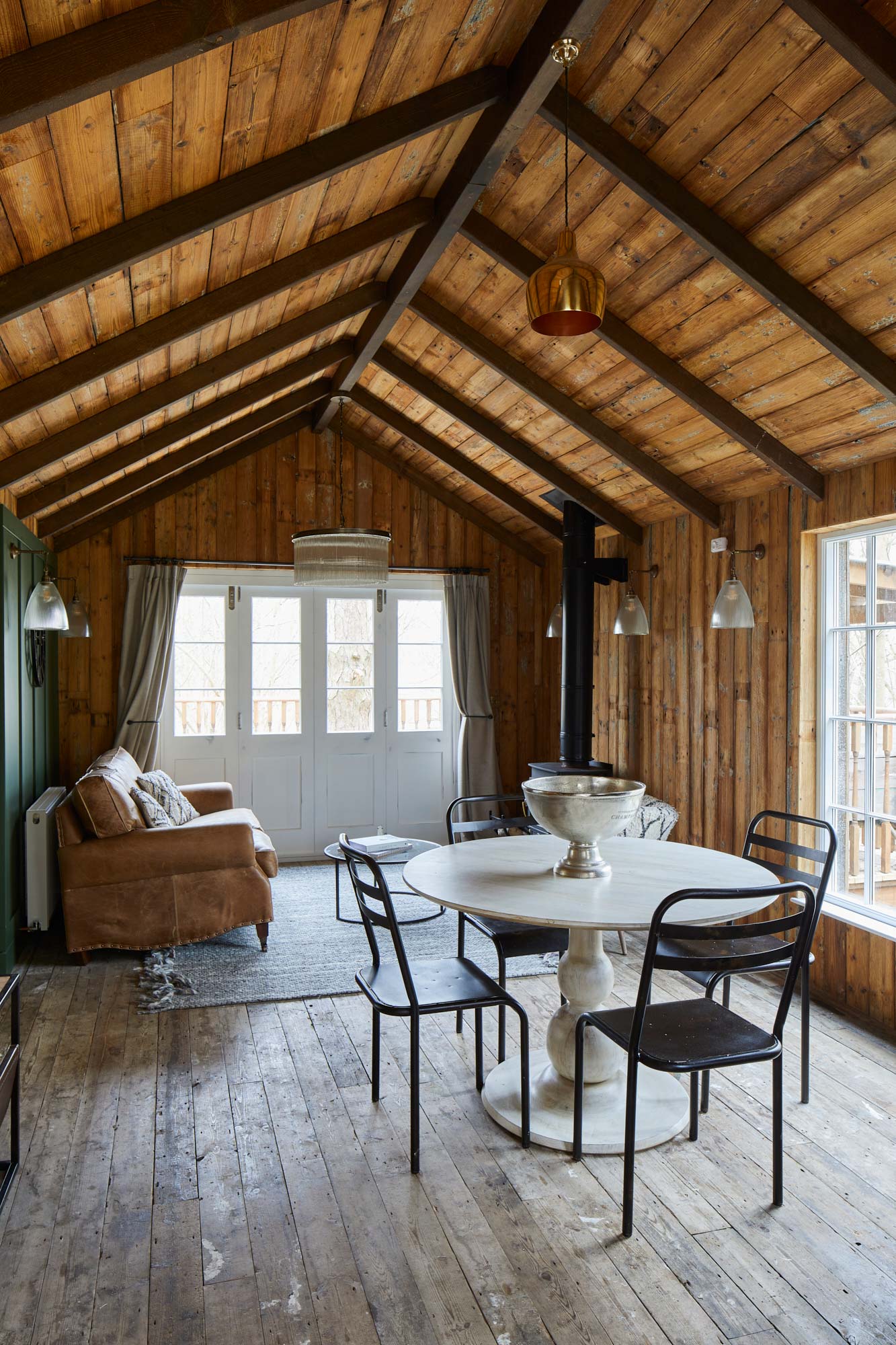 Reclaimed wood flooring and cladding in treehouse