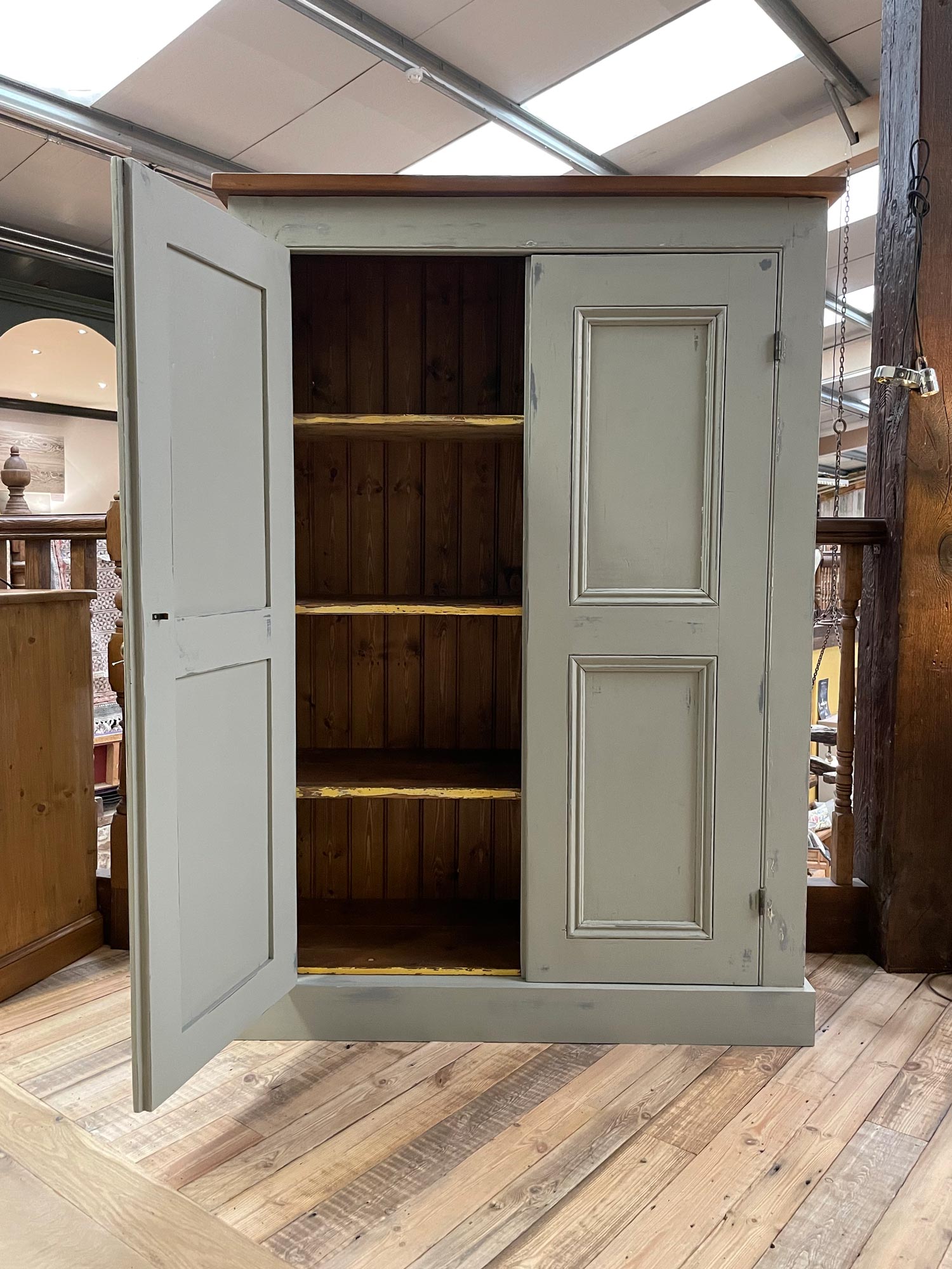 Door open on antique storage cabinet