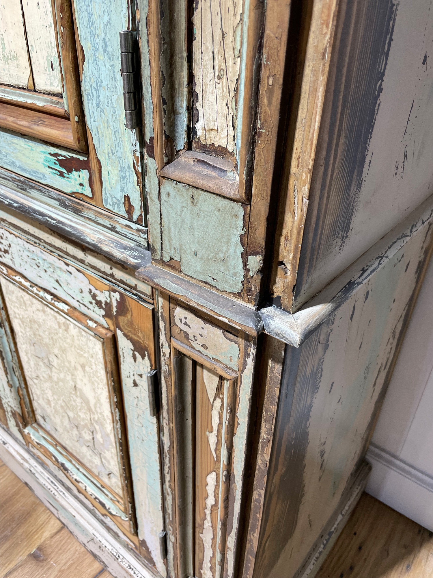 Wood detail on distressed storage unit