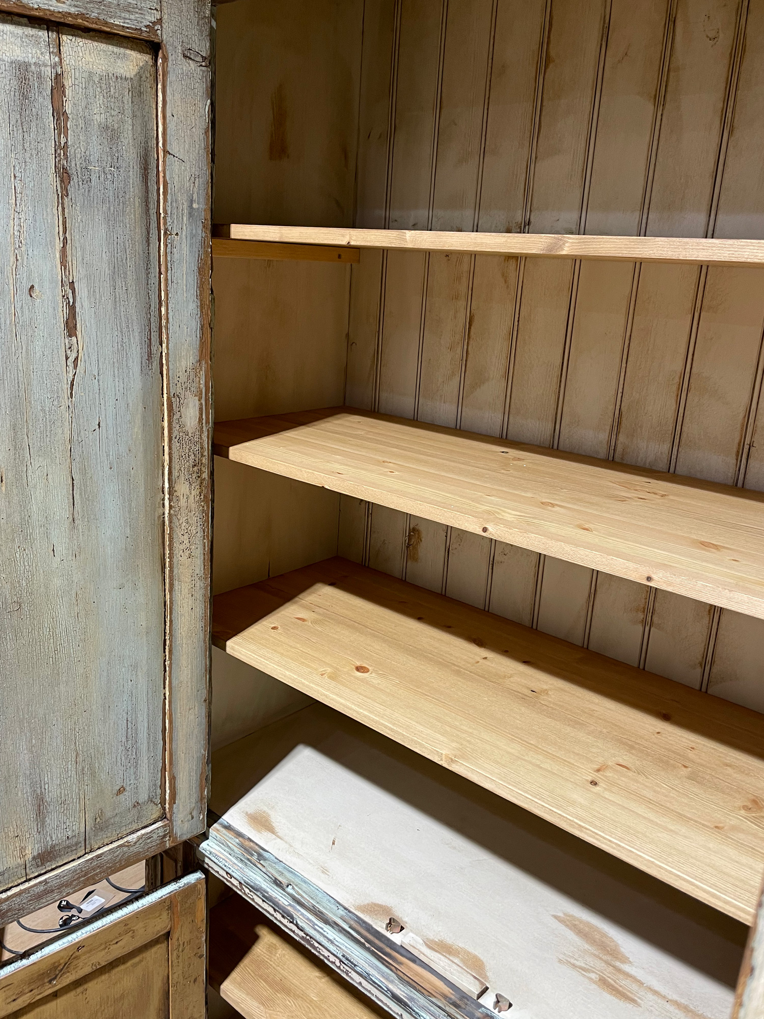 Shelves inside distressed storage unit