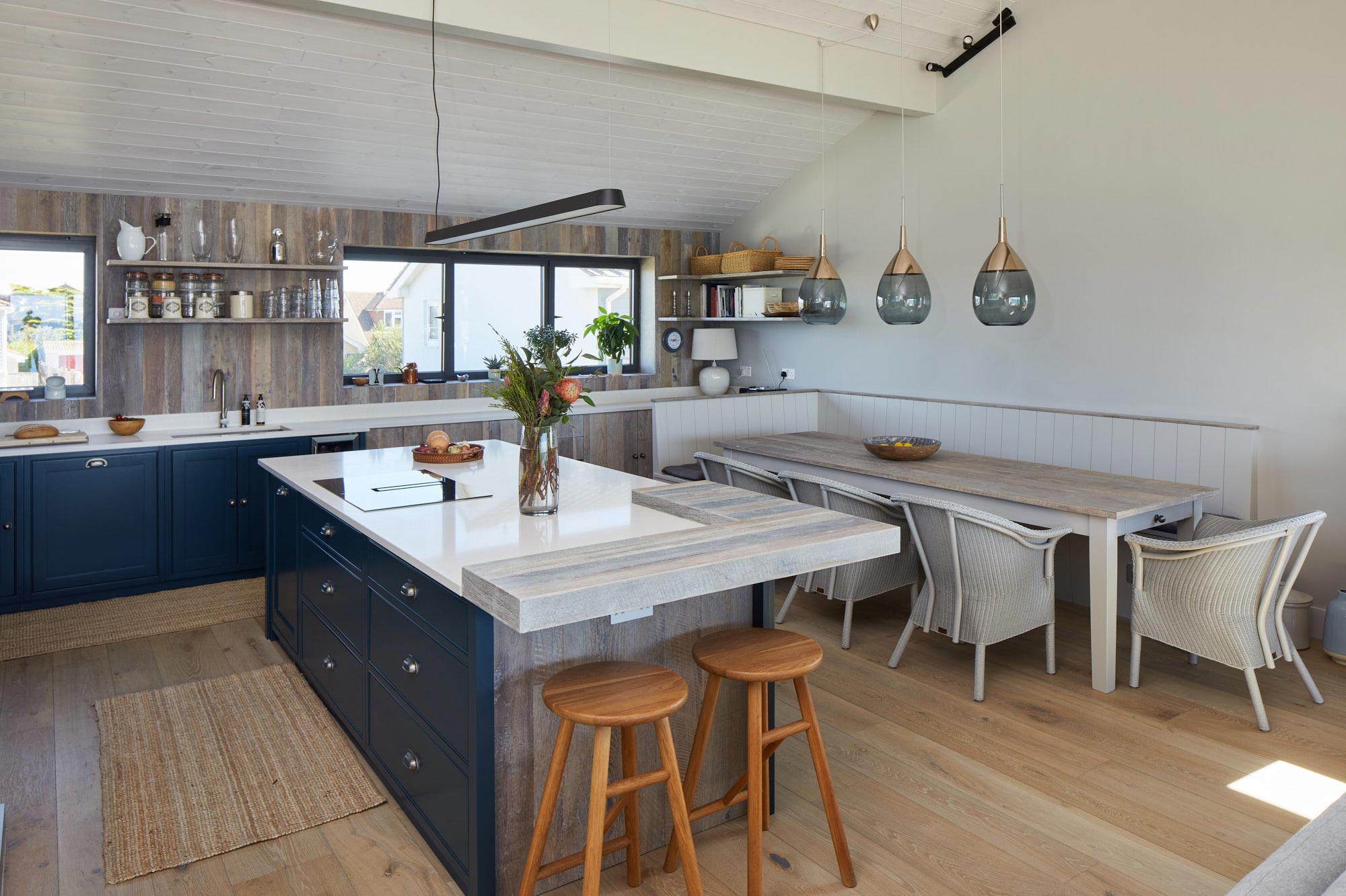 Large bespoke kitchen with integrated breakfast bar