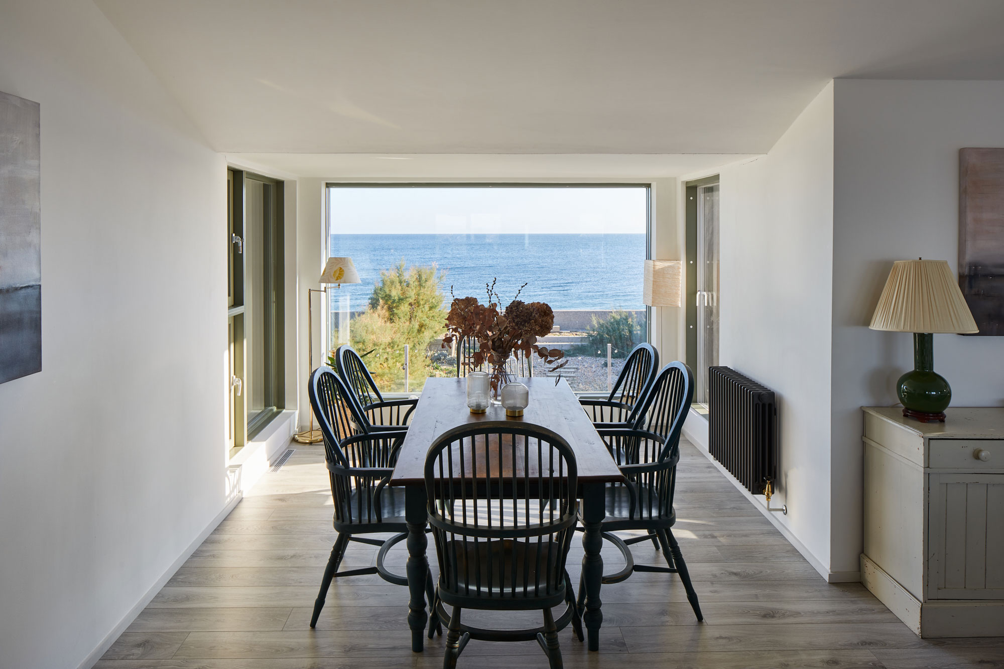 Painted farmhouse dining table with black chairs