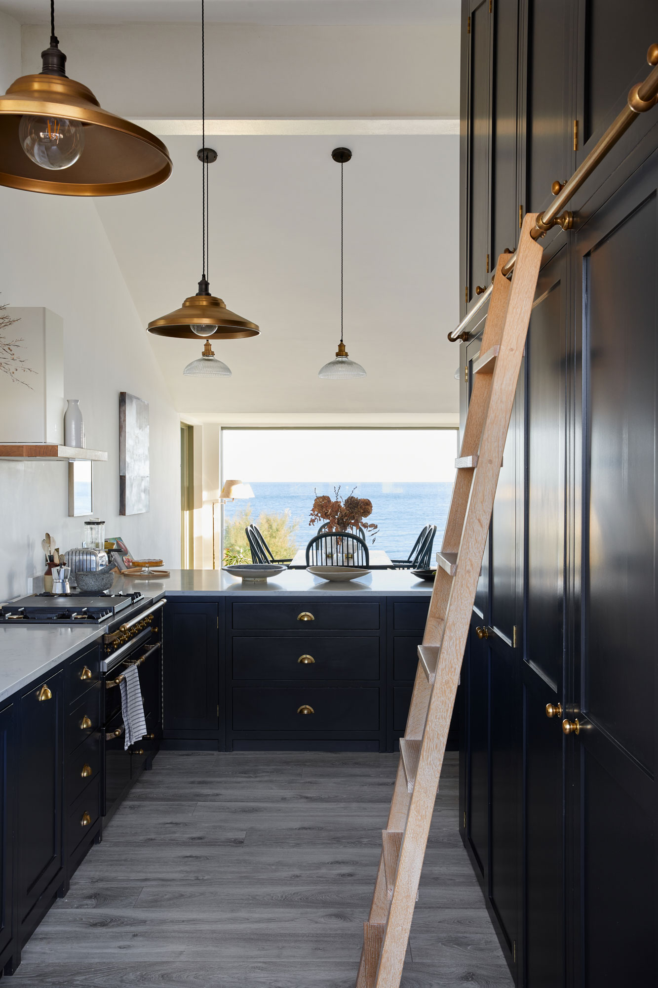 Tall kitchen larder with limed oak ladder