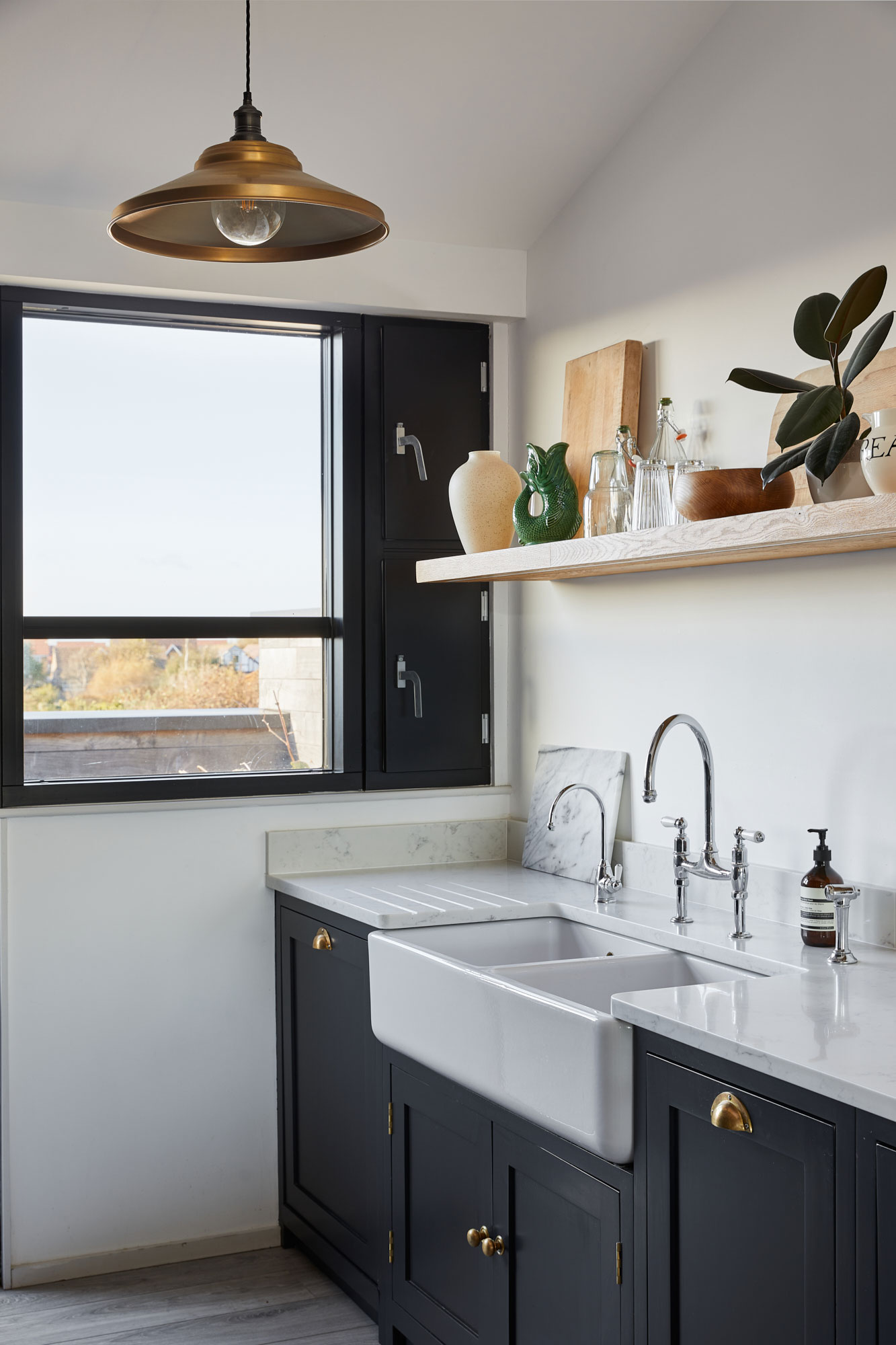 Double belfast utility sink with deep blue bespoke kitchen cabinets