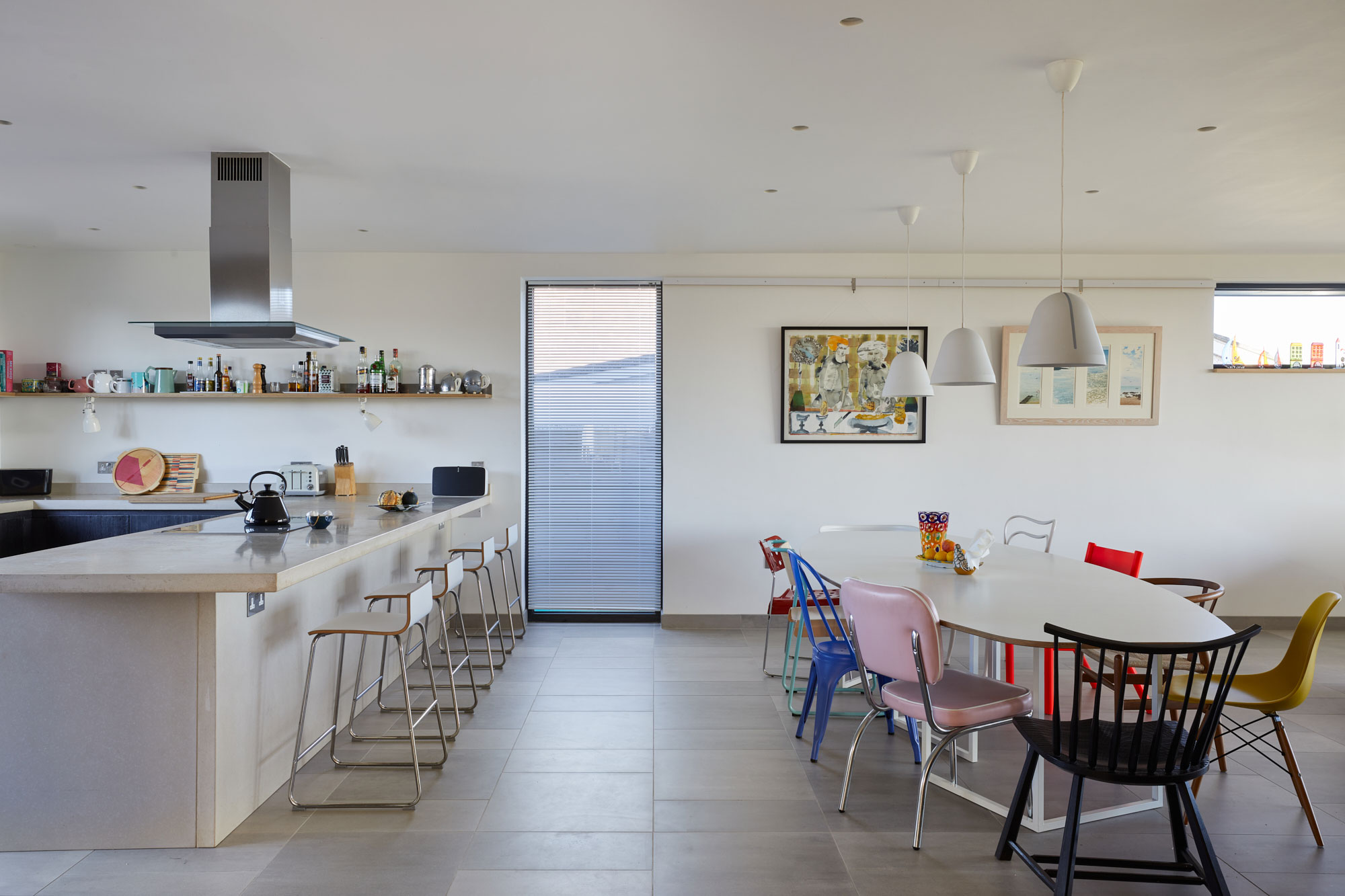 Open plan modern kitchen with solid concrete counter worktop