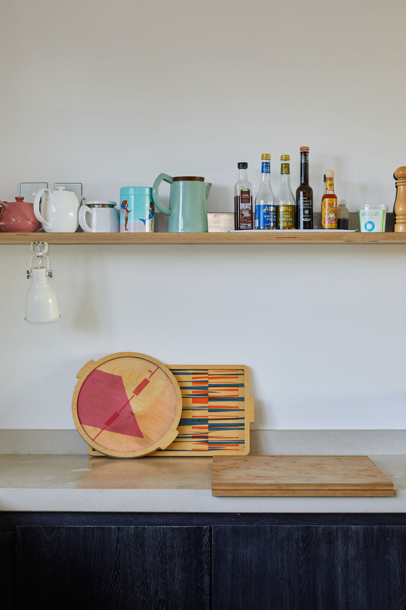 Floating kitchen shelf with lots of condiments