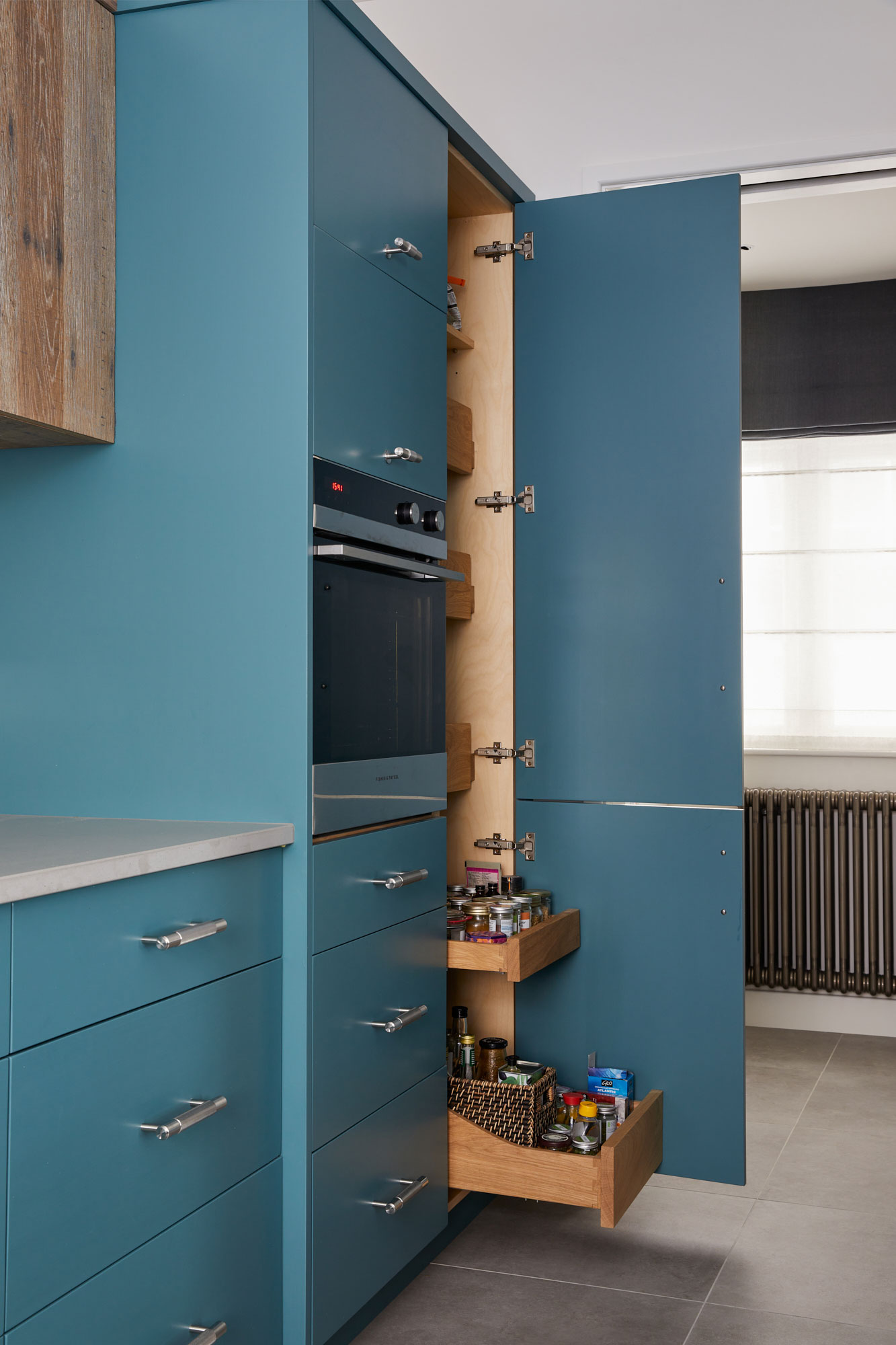 Pull out larder racks inside bespoke painted kitchen