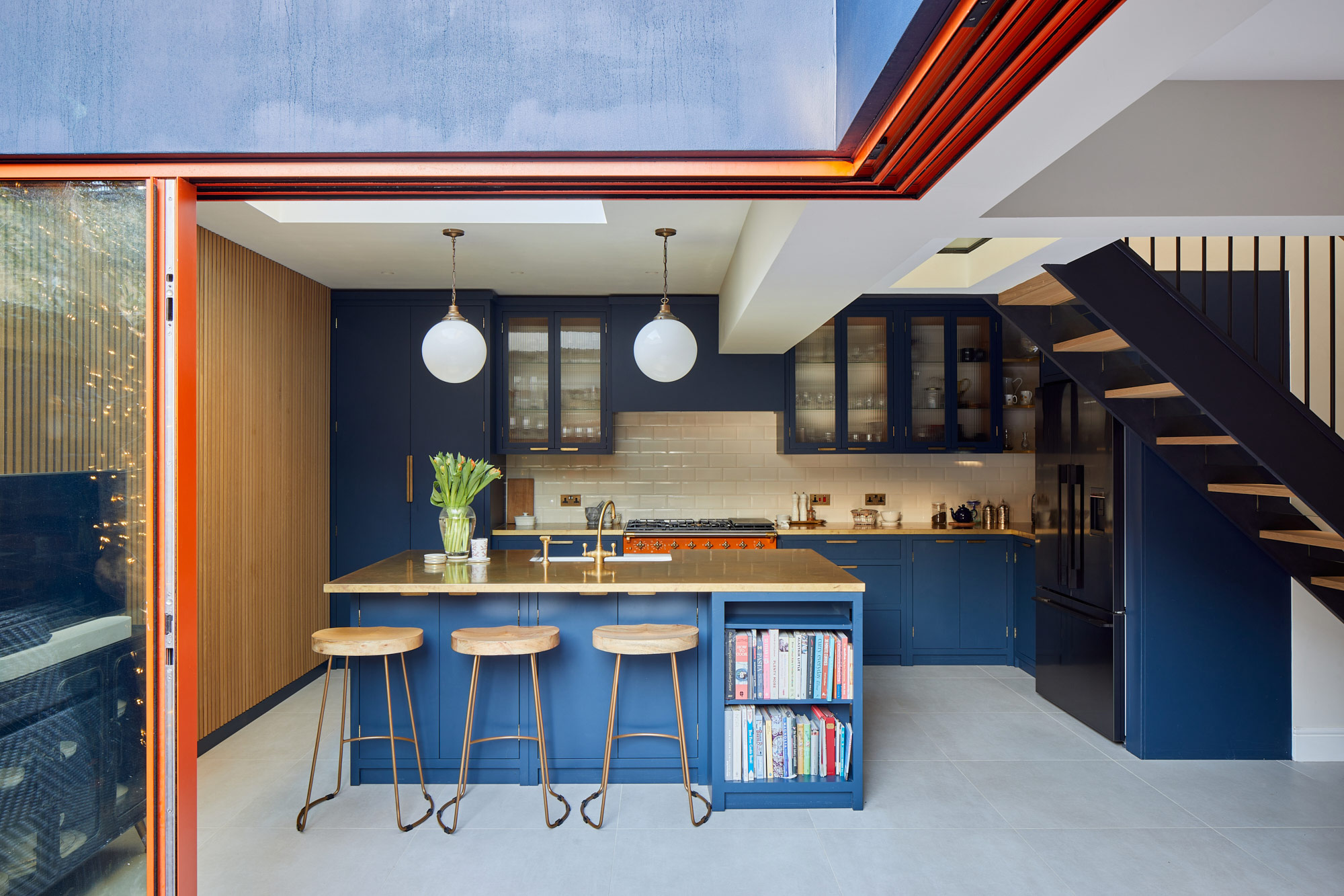 Open plan blue painted kitchen