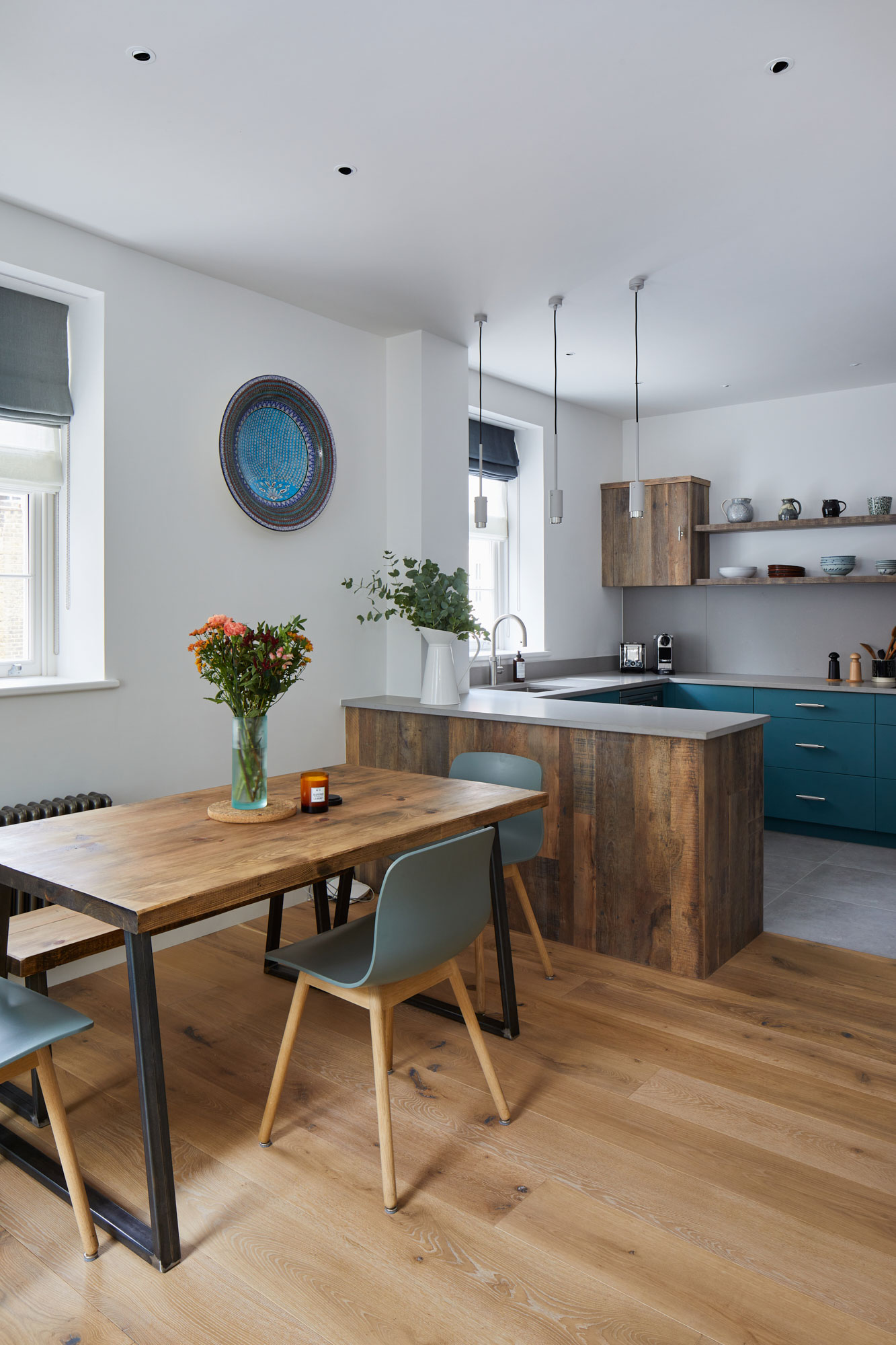 Industrial dining table in open plan bespoke kitchen